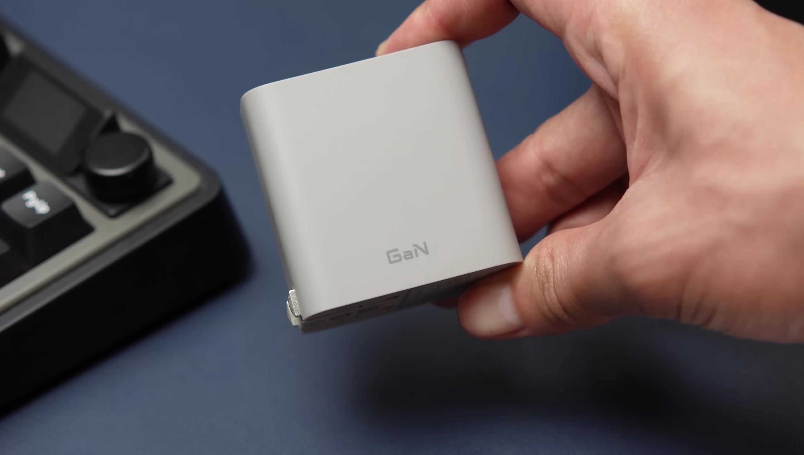 Close-up of the CUKTECH 65W GaN charger showcasing its compact size and ports.