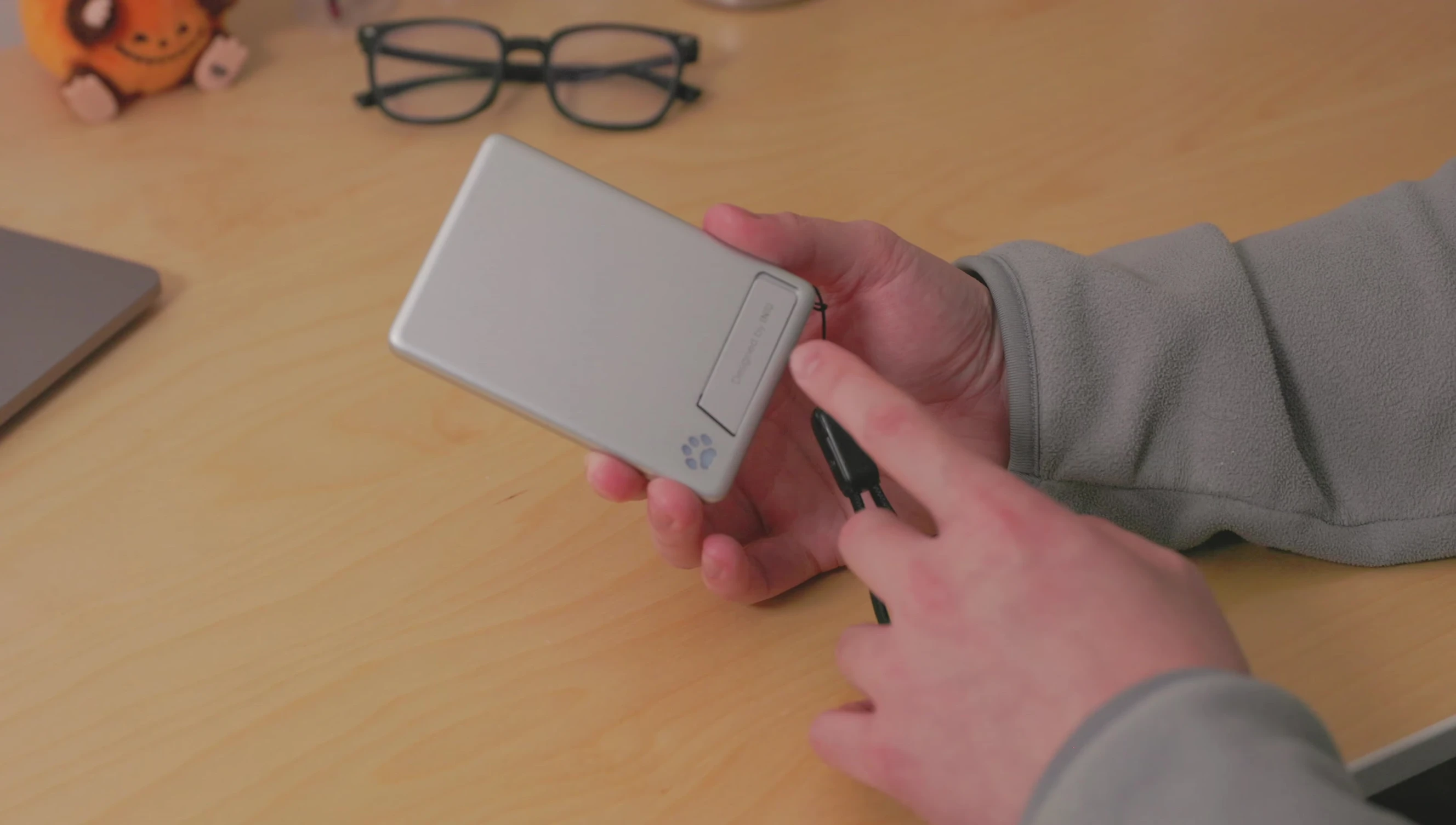 The power bank demonstrating its built-in foldable stand.