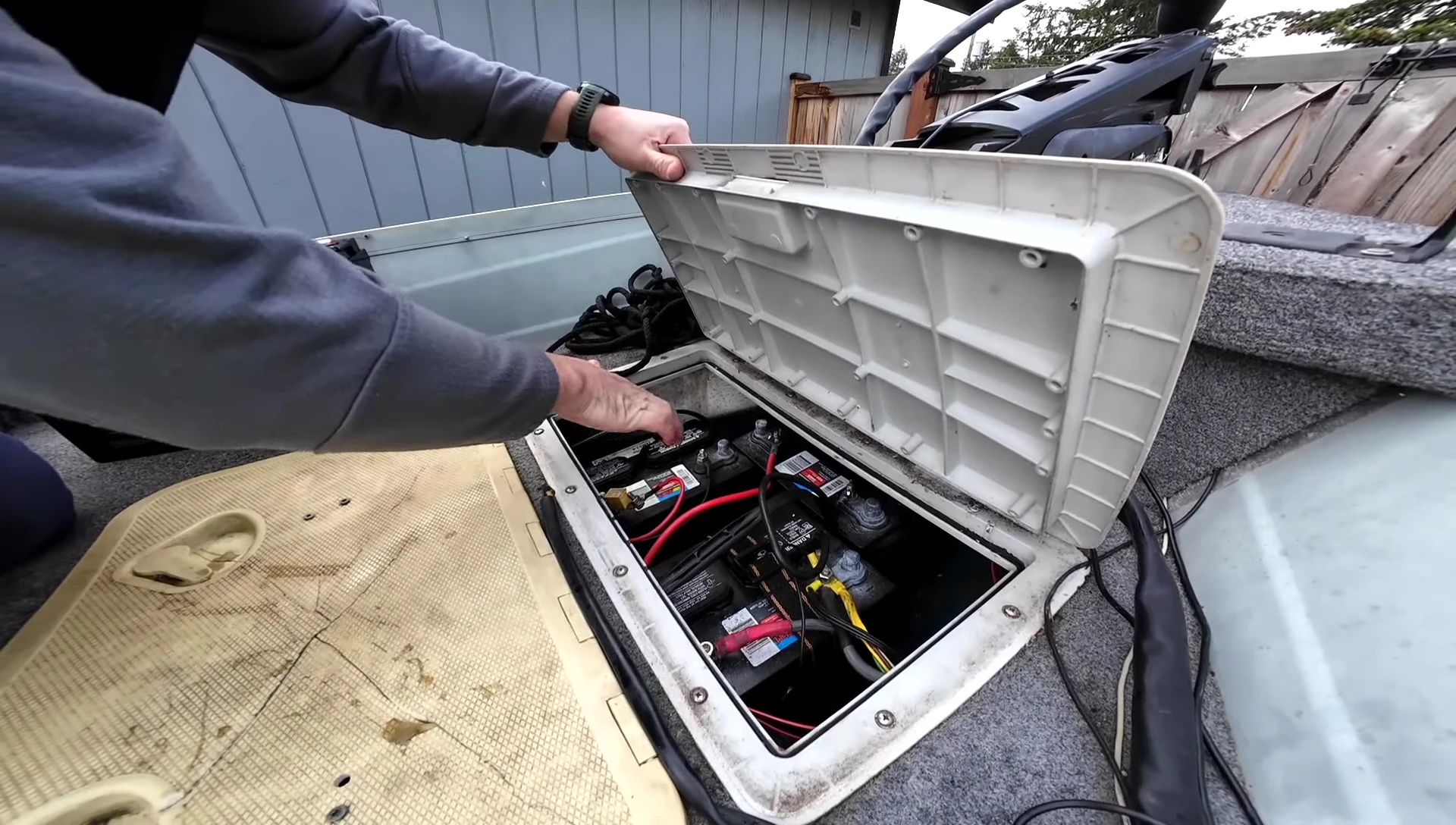 Removing the old lead-acid battery from the boat.