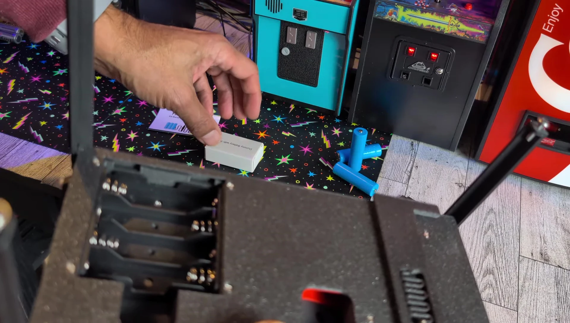 The adapter being installed inside the battery compartment.