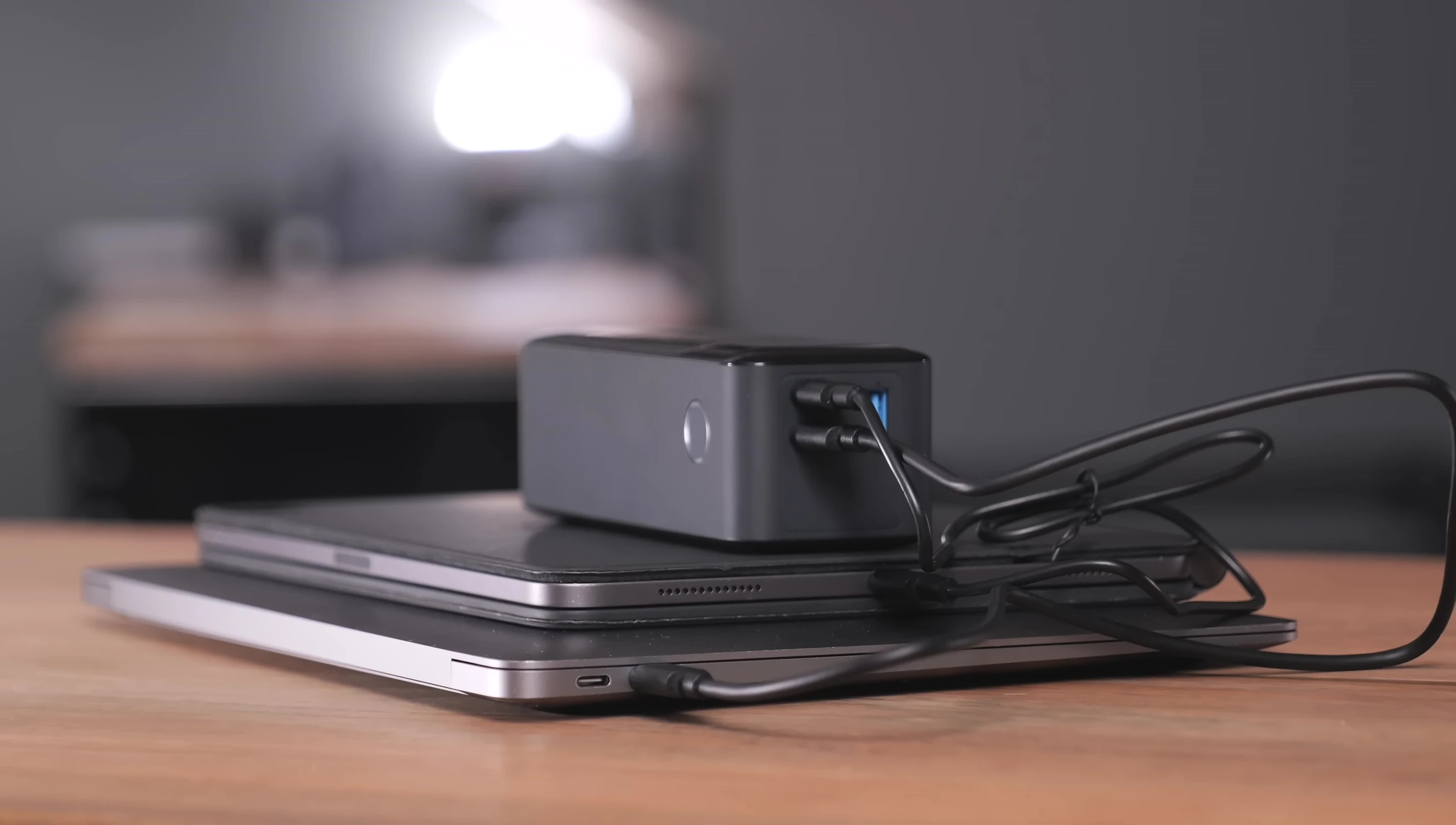 The reviewer showcasing the Anker 737 charging multiple devices.