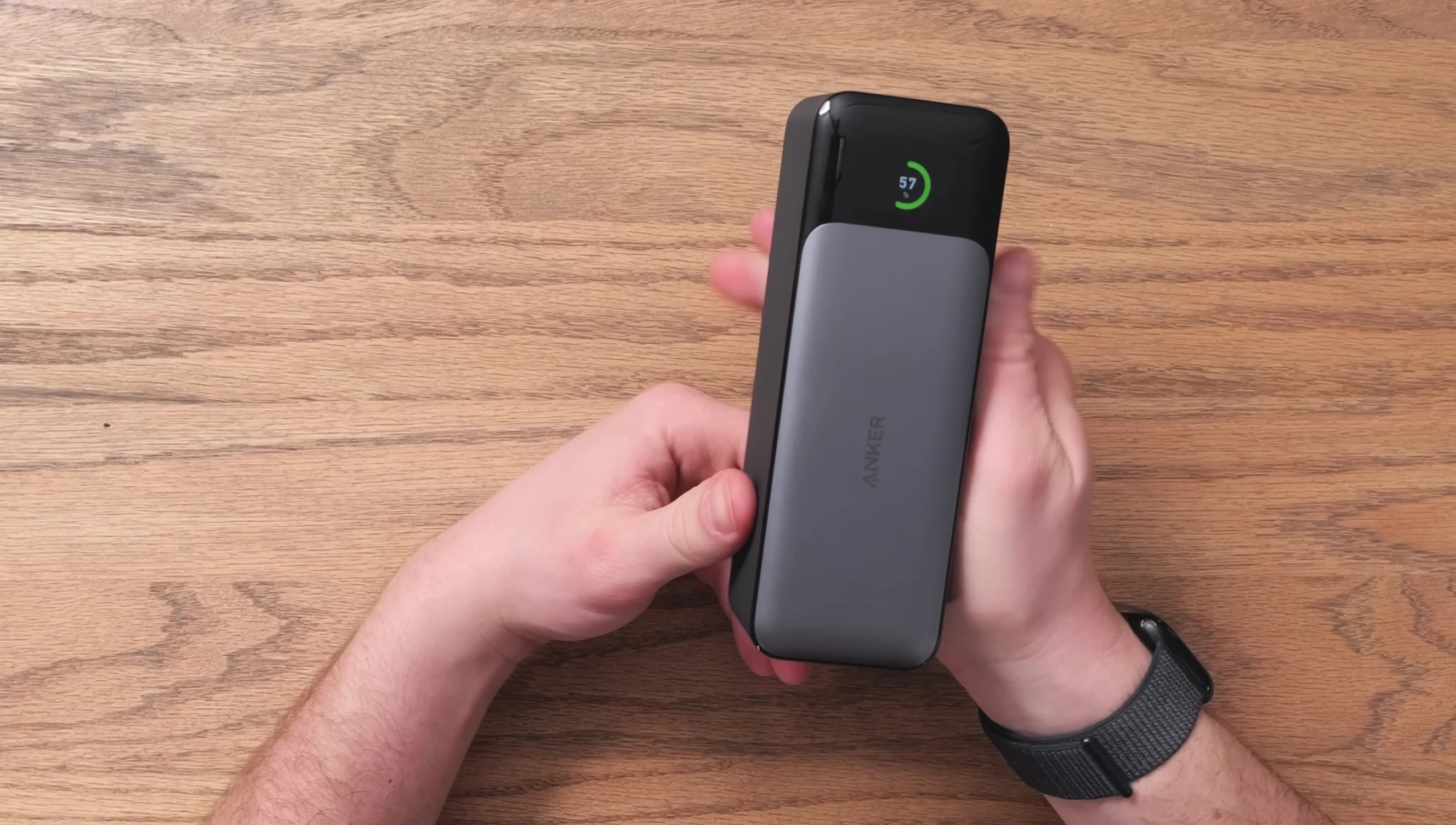 The Anker 737 power bank compared to an energy drink, showing its size.
