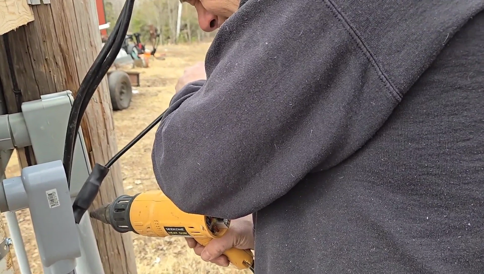 Using the Li Time battery to power a heat gun during a solar panel installation.