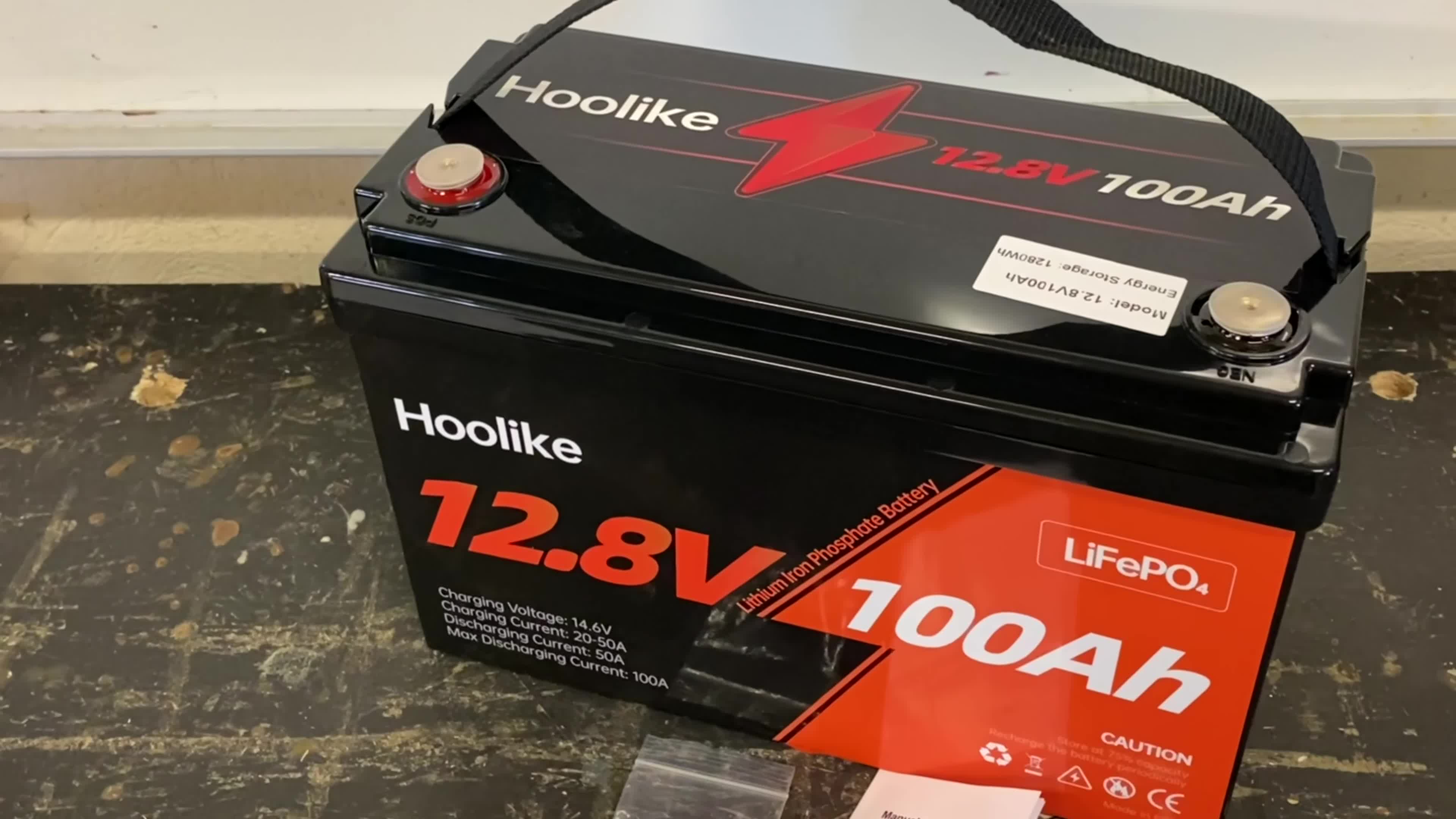 Unboxing the Hoolike LiFePO4 battery, showing the contents.