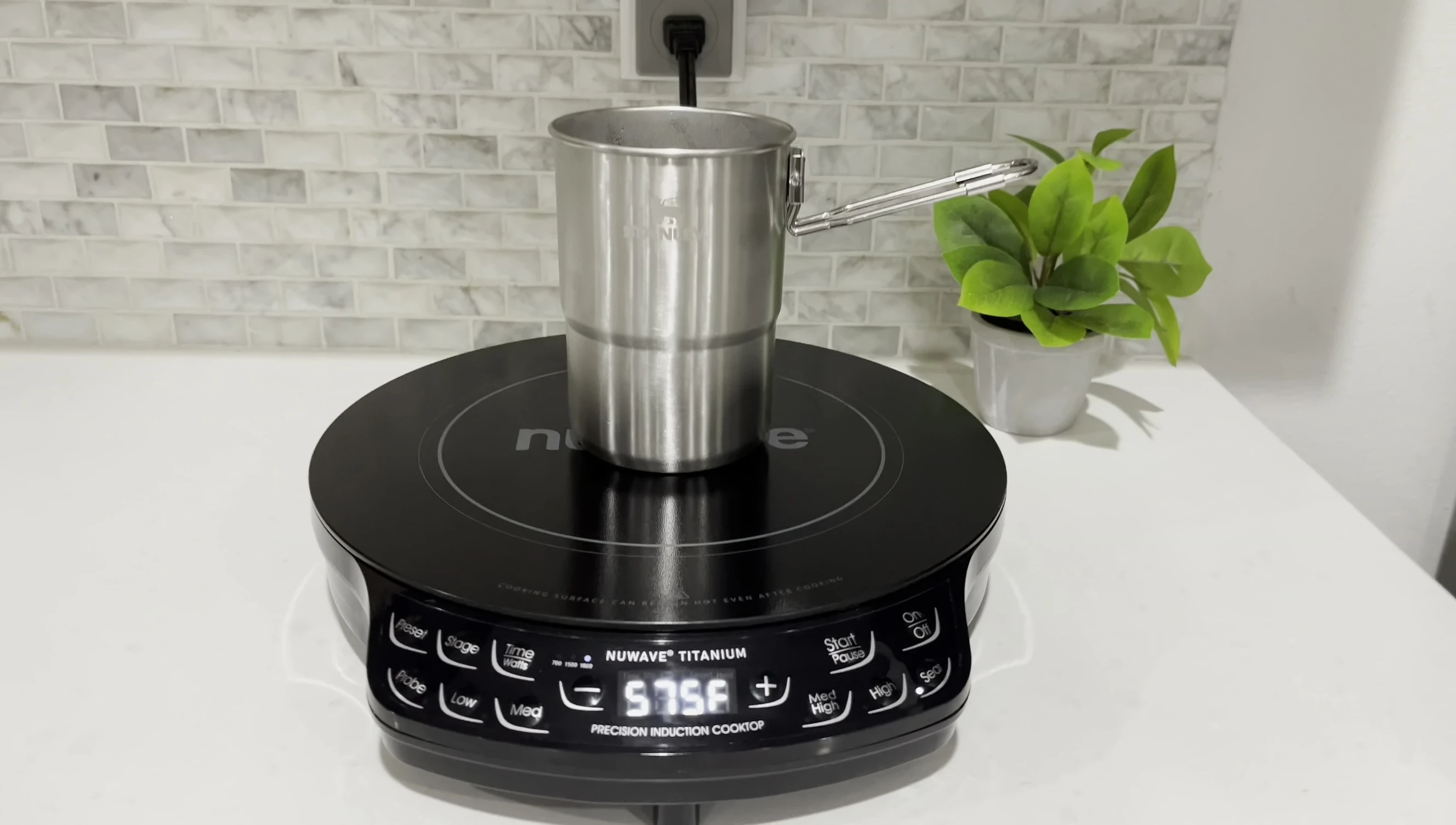 A 3.5 inch Stanley camping pot on the cooktop
