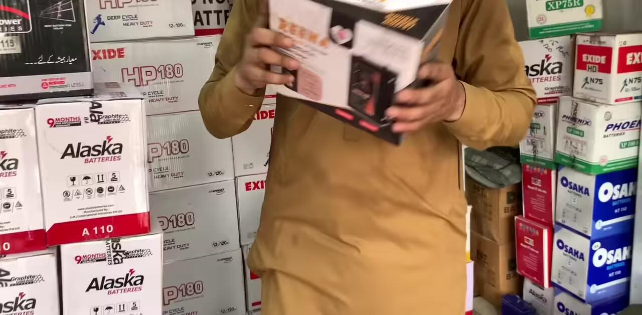 Speaker pointing to a charger