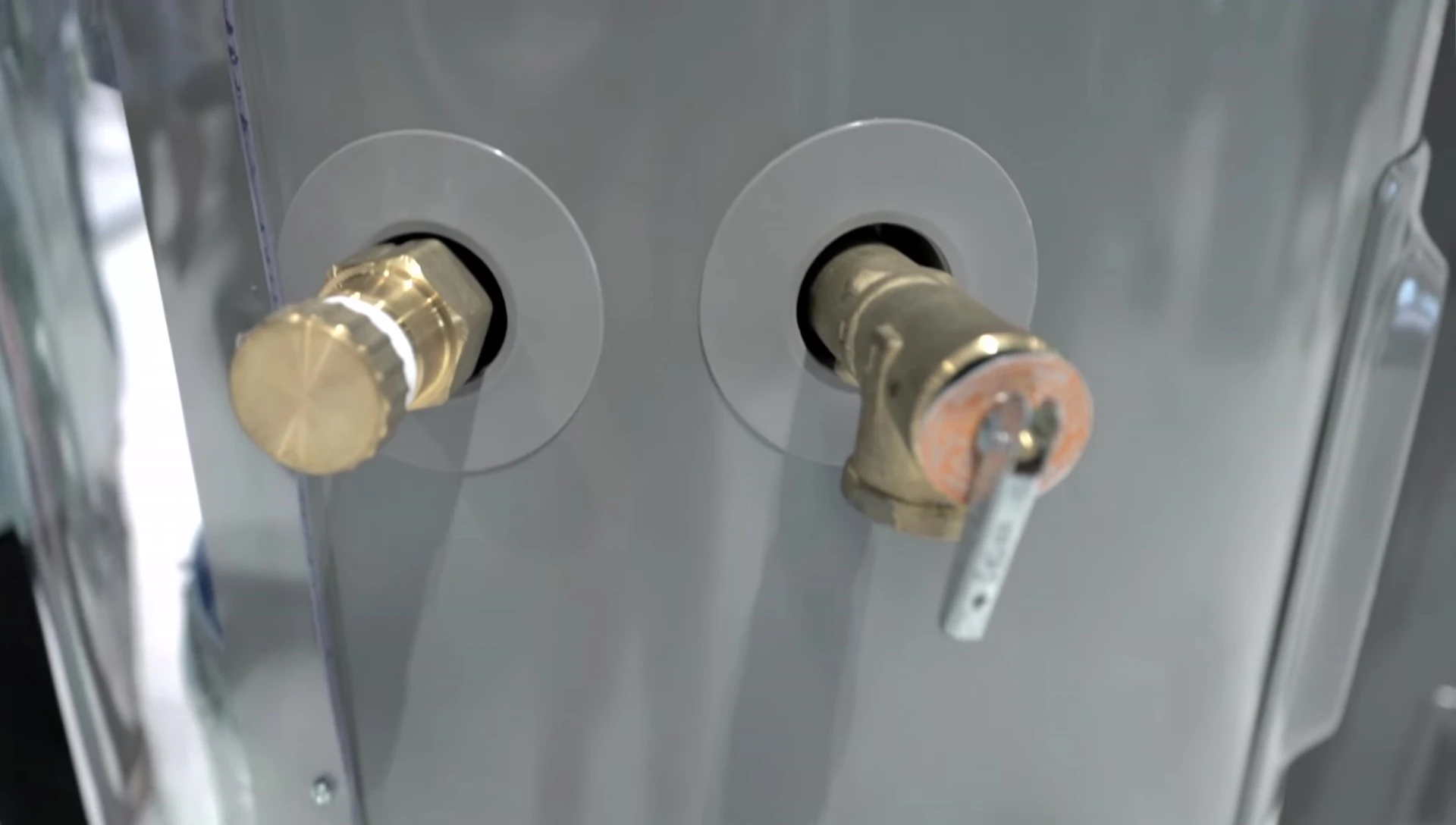 Close-up of the top and side connections on the Rheem ProTerra water heater tank.