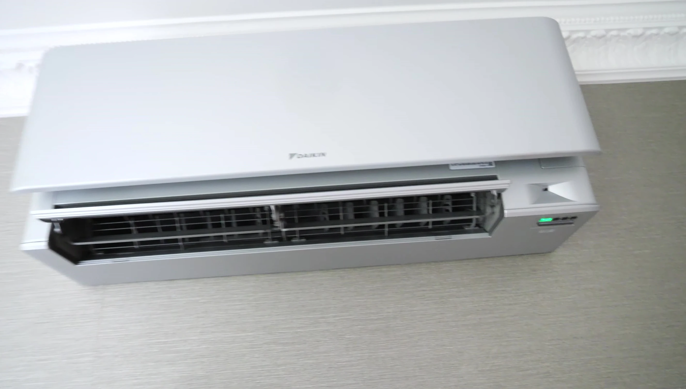 Demonstration of easily accessing and removing the filters from the Daikin Stylish.