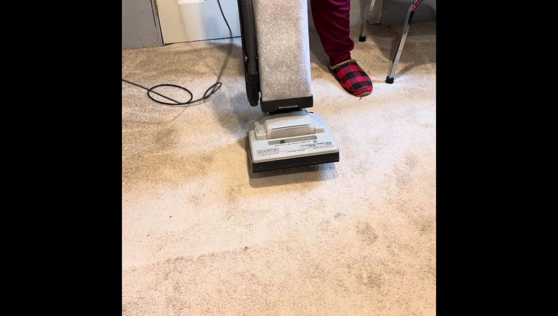 The speaker about to turn on the vintage vacuum.