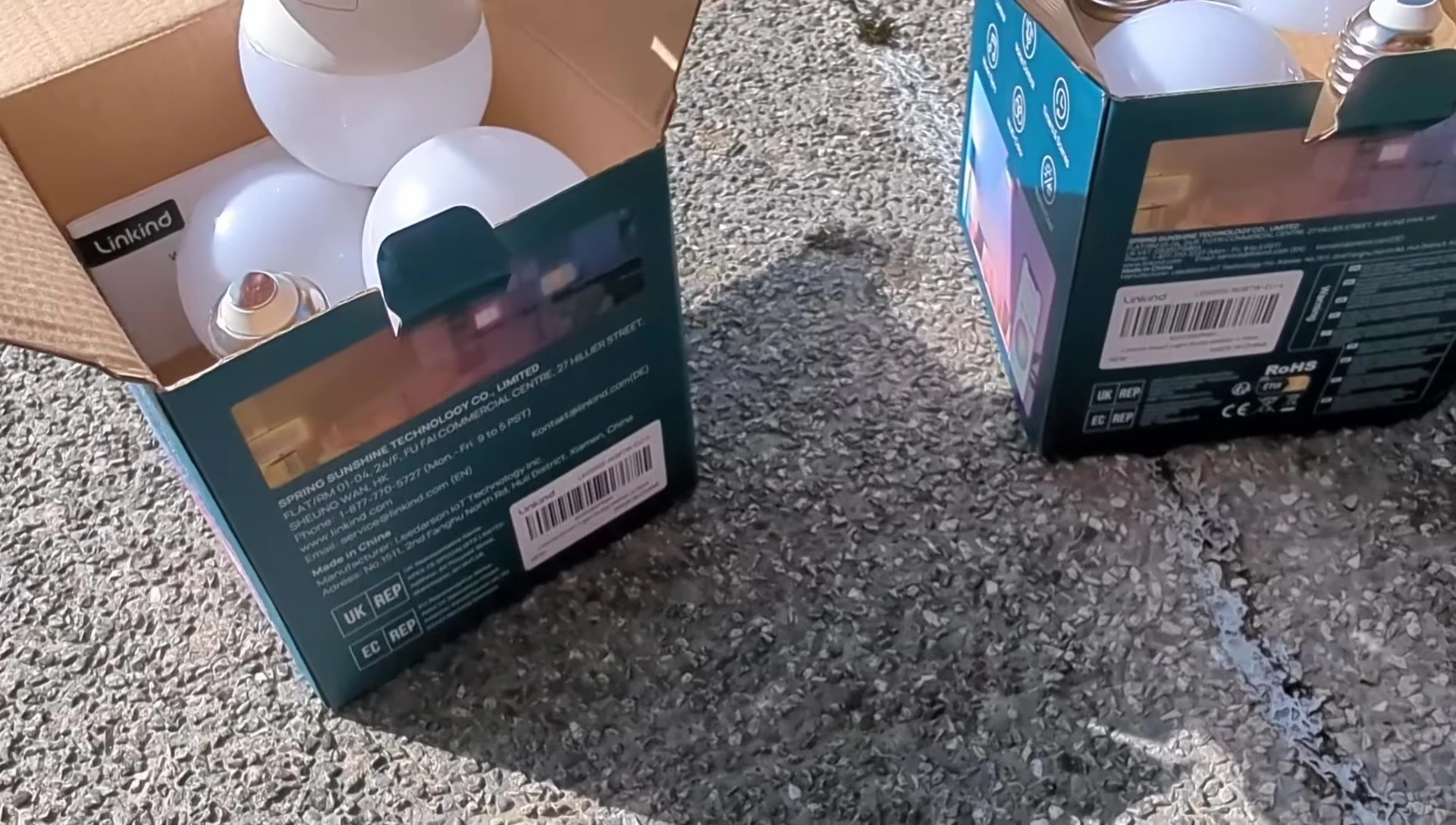 Shot of the contents of the packaging: bulbs, LED strip, controller, and power adapter.