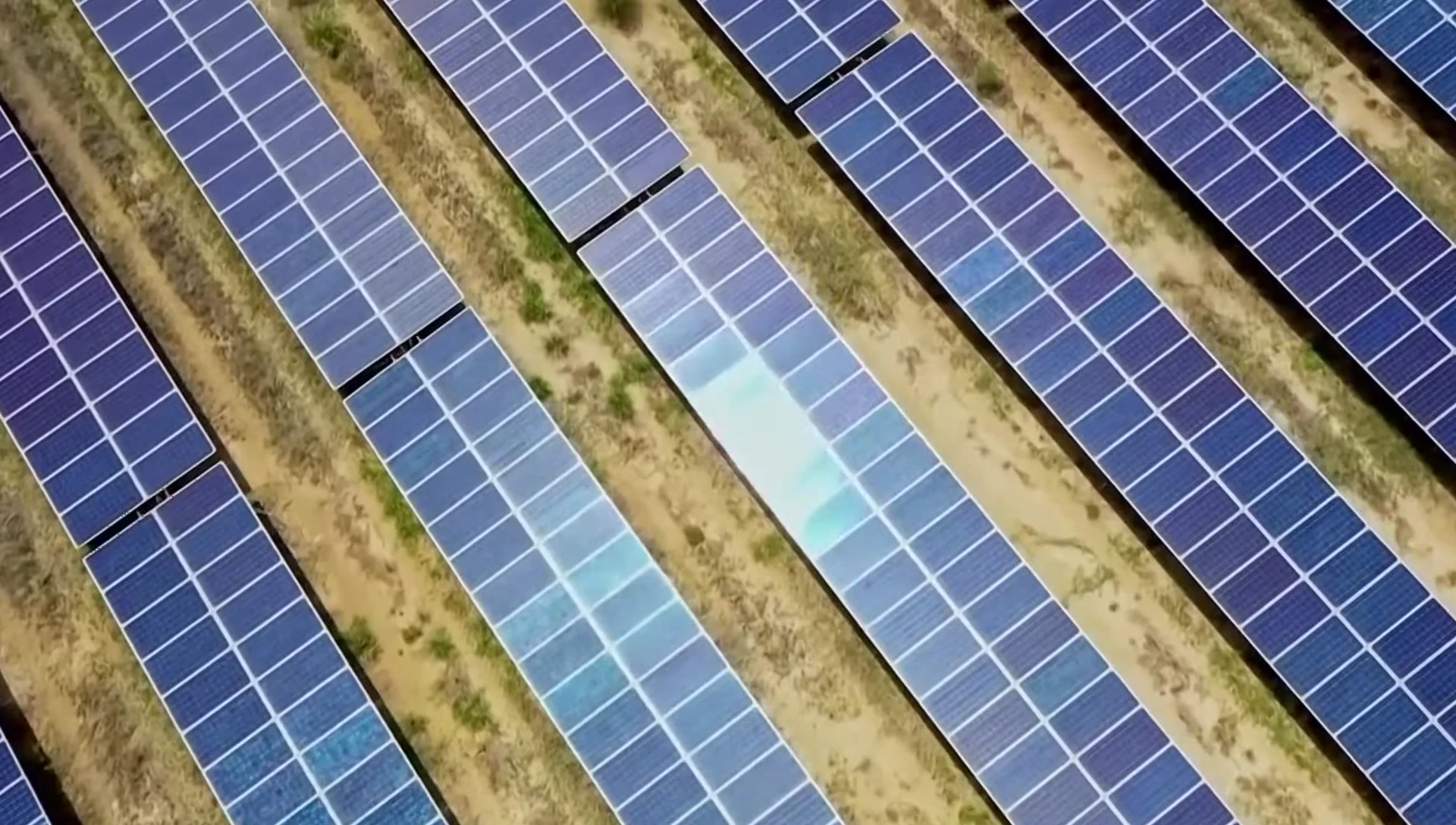 Image depicting solar panels covered in snow, highlighting weather-related efficiency losses.