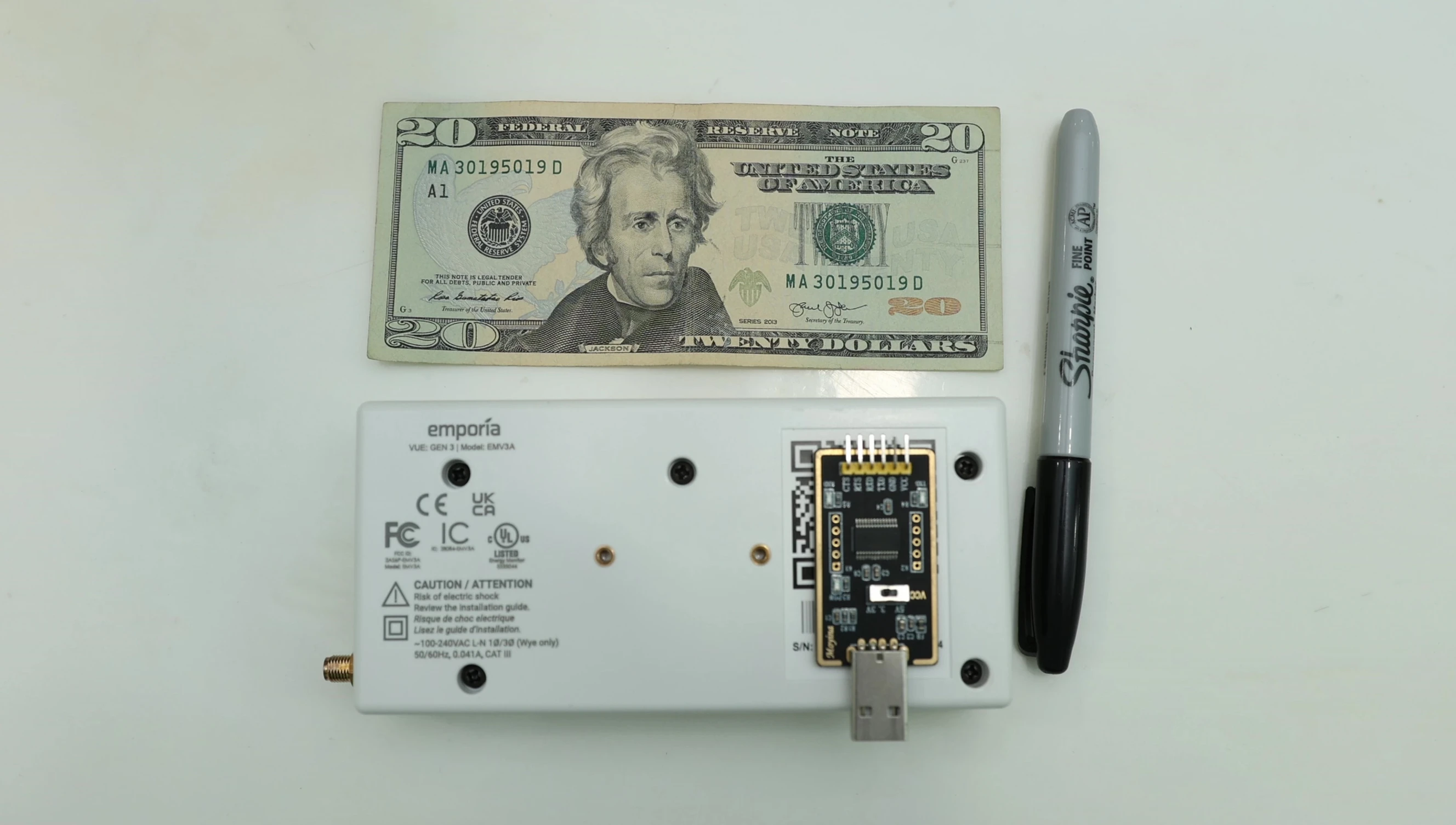 Image showcasing the process of opening the Emporia Vue Gen 3 unit for firmware access.