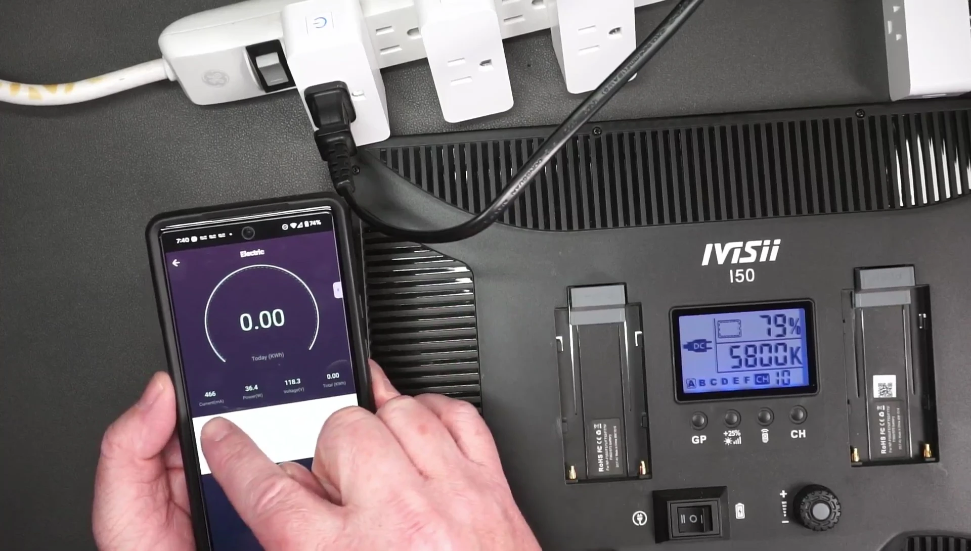 Screenshot of the app displaying real-time power usage in watts and kWh.