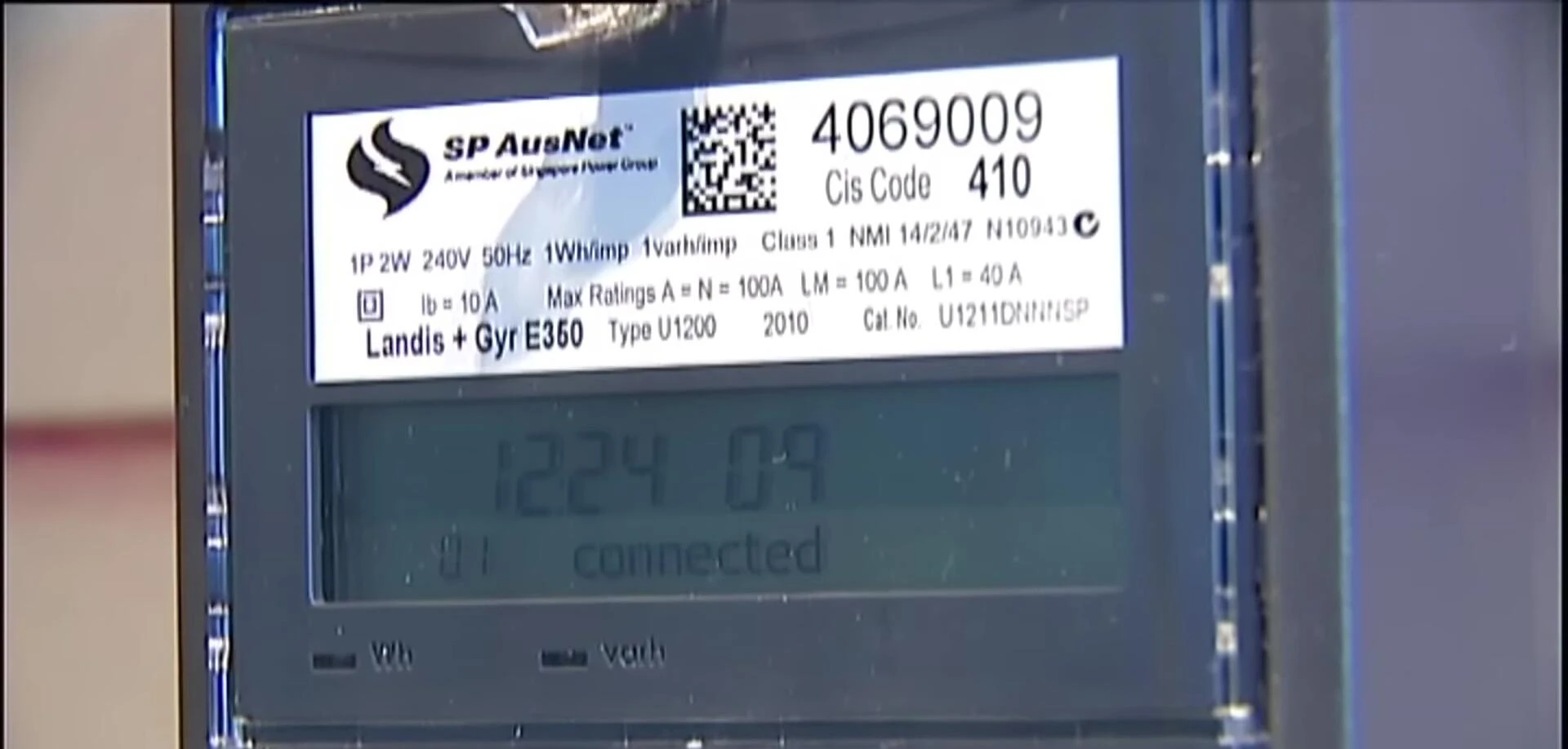 Close-up shot of a smart meter displaying energy usage data.