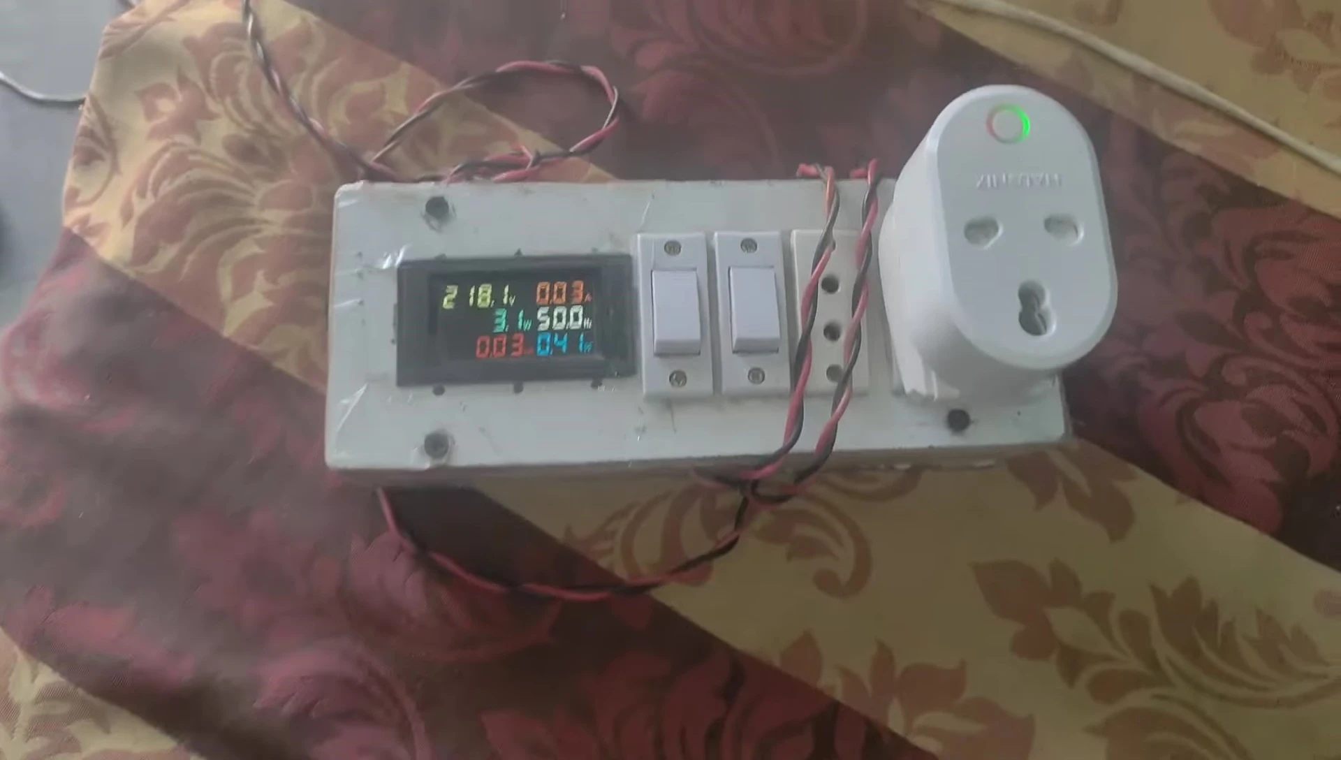 The Halonix smart plug showing the green indicator light.