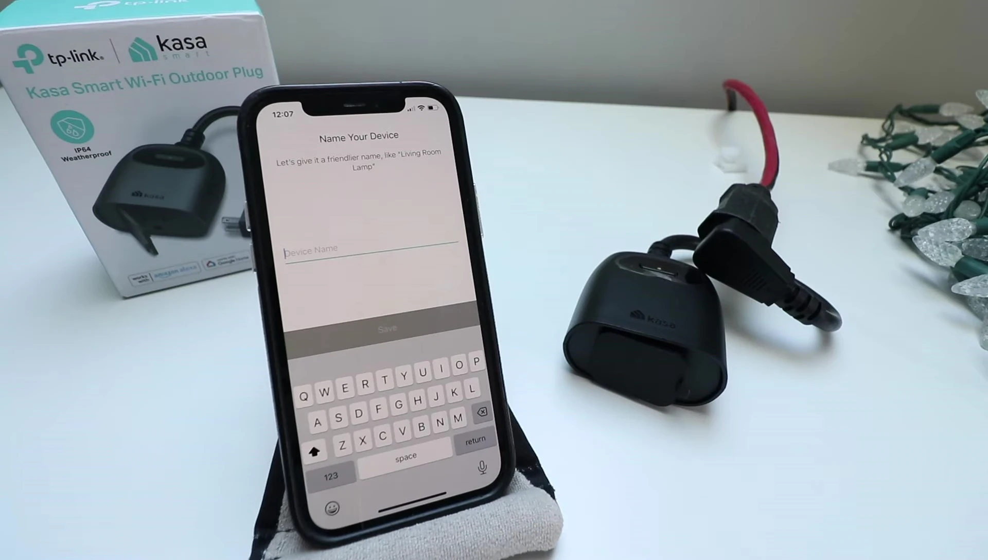 Screenshot of the Kasa Smart app showing the option to name the outdoor plug.