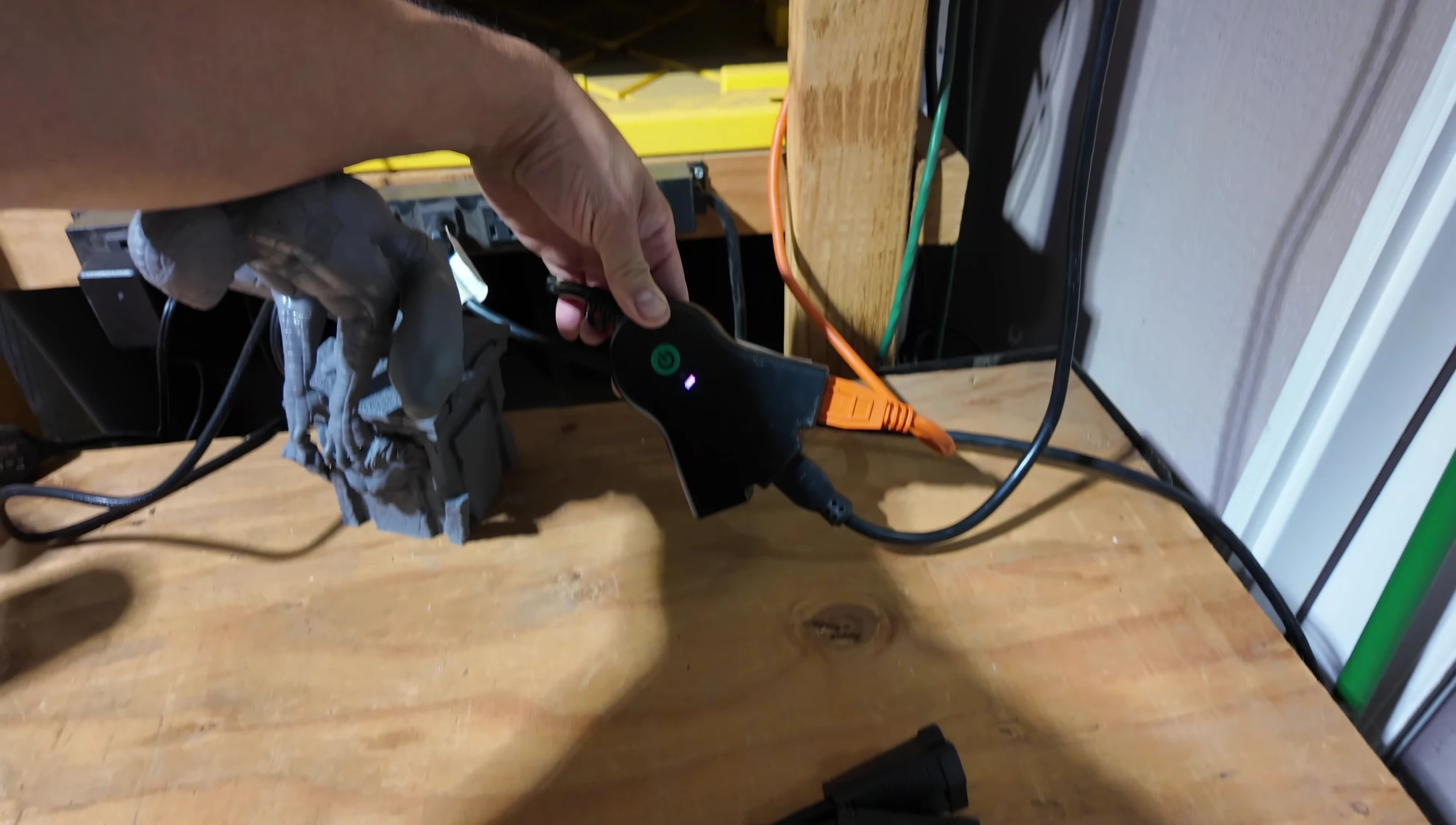 Comparison shot of the old setup with multiple splitters versus the new BN-LINK Smart Outdoor Outlet.