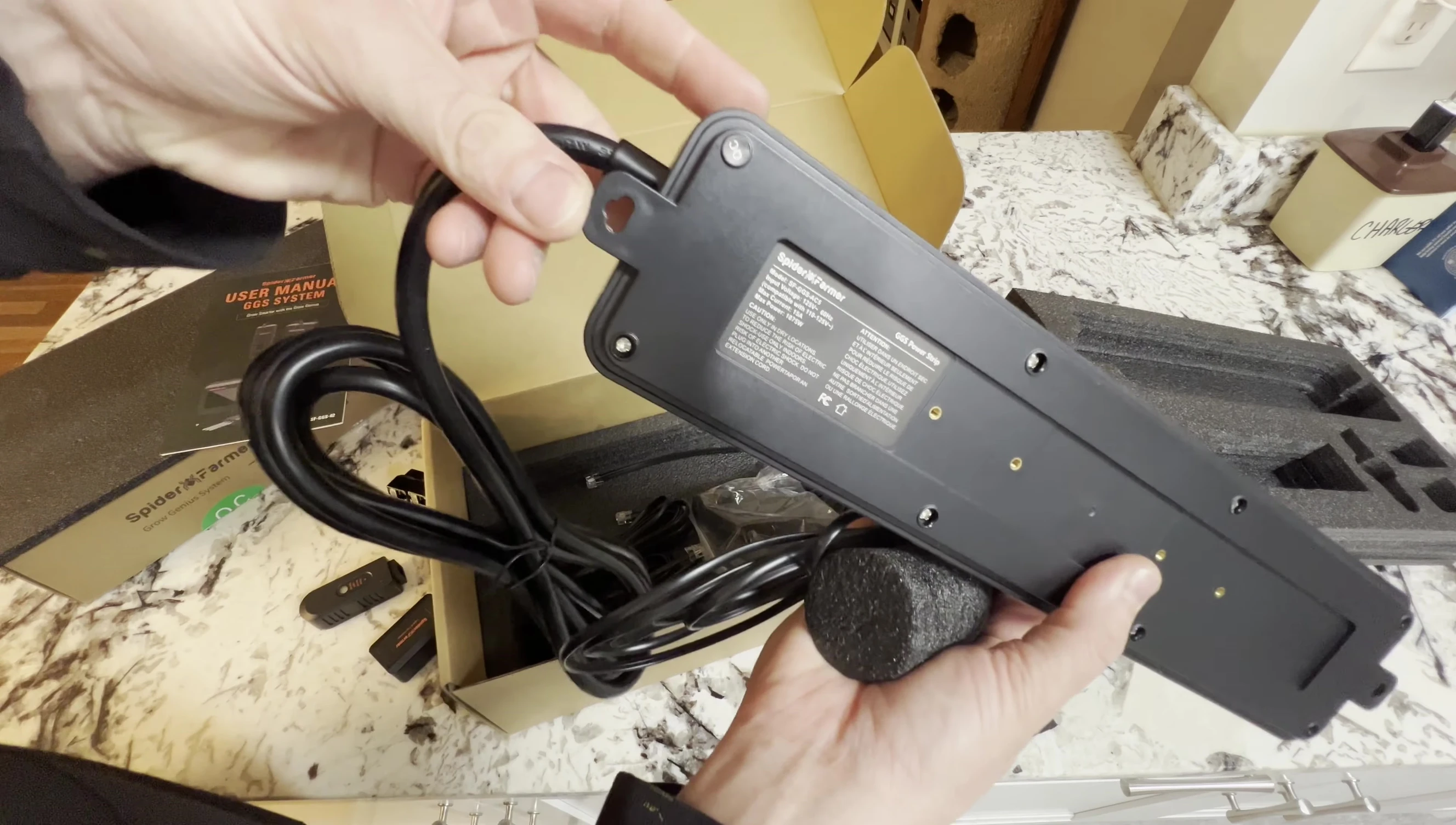 Showing the mounting holes and brackets on the power strip