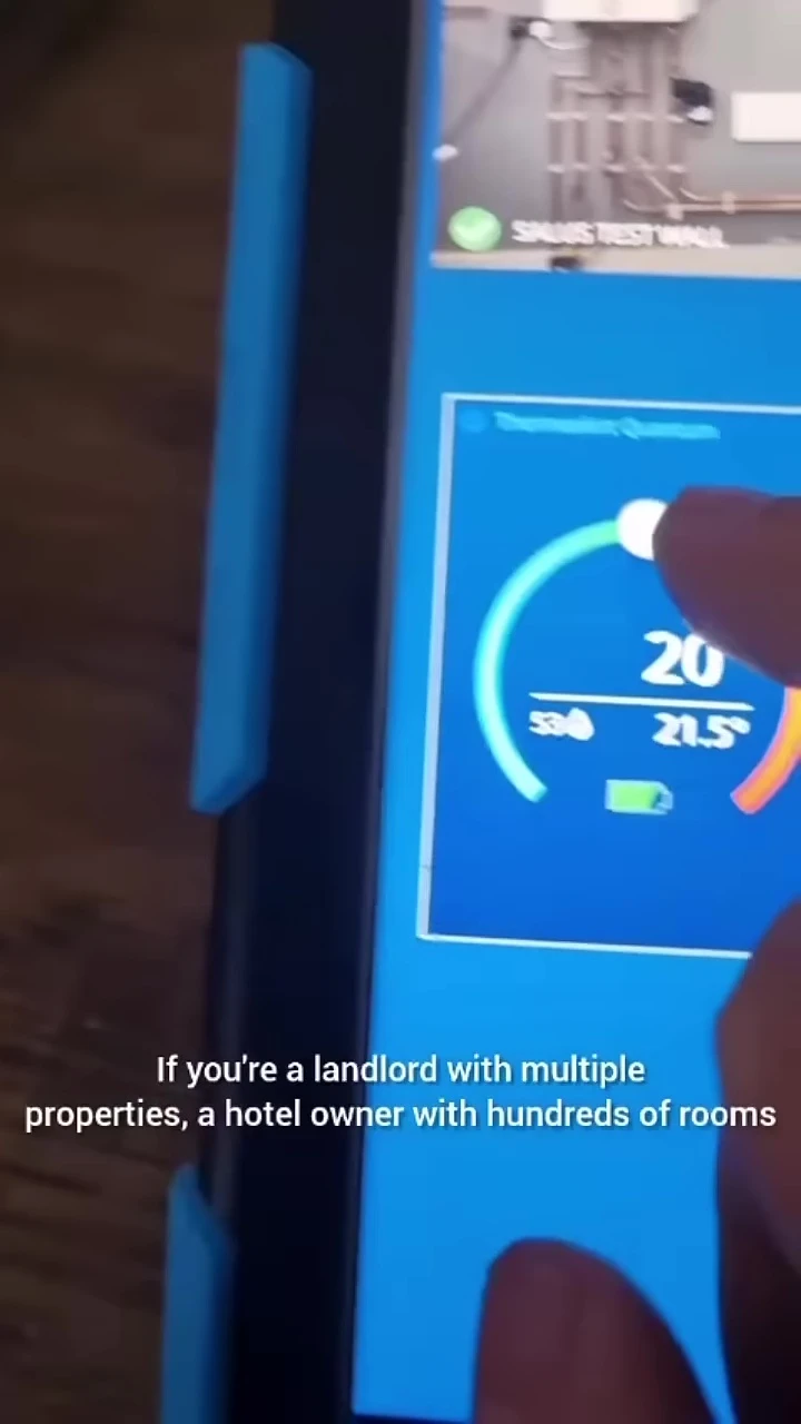 Image depicting a hotel room or Airbnb with a smart thermostat.