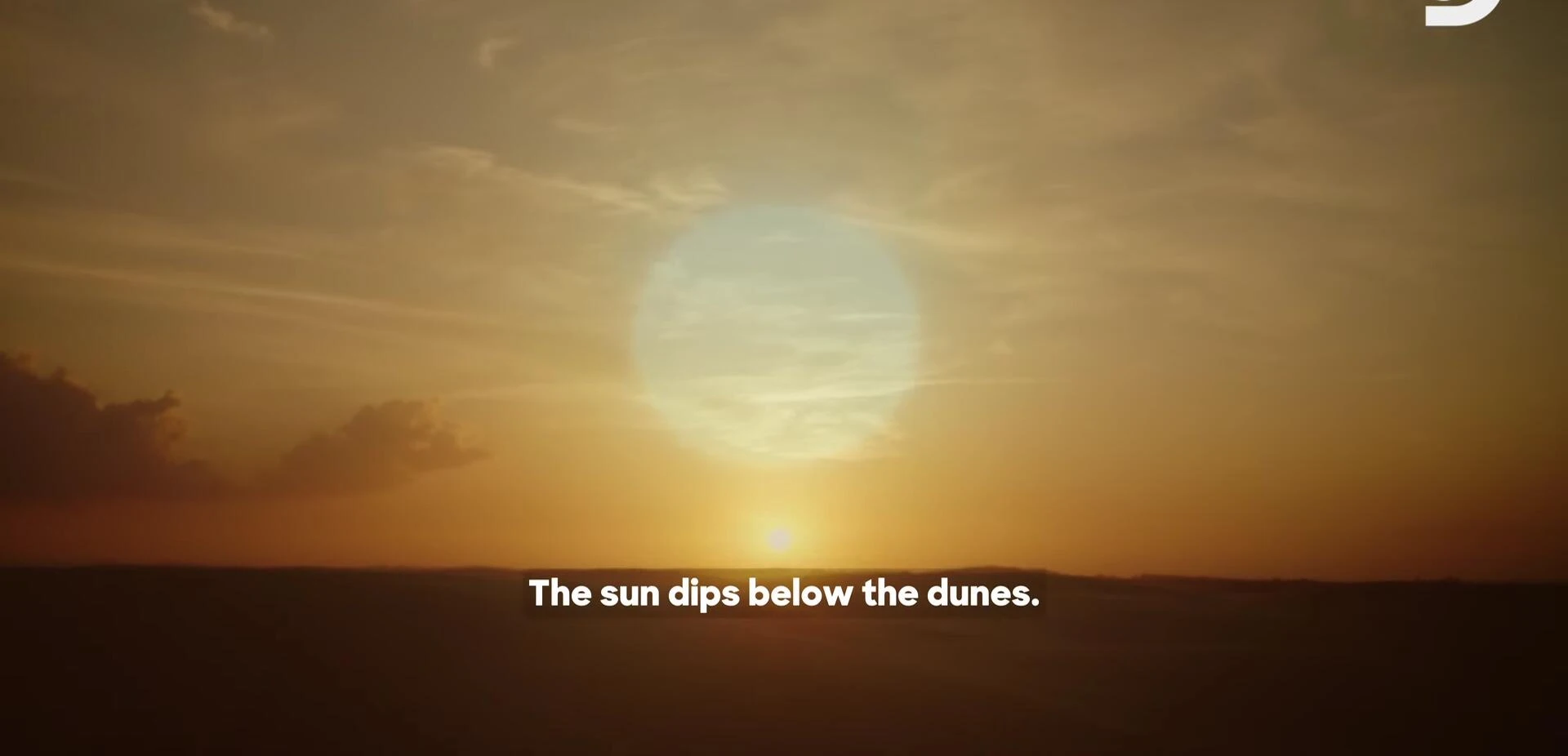 The sun setting over the dunes