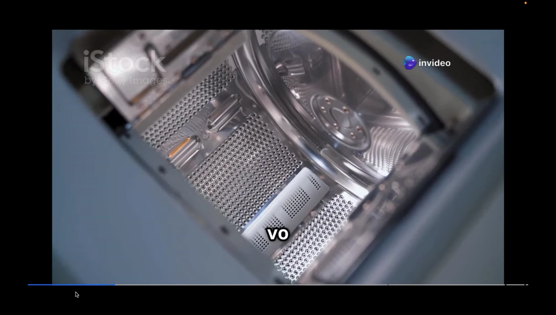 A closeup shot of a top load washing machine's interior.