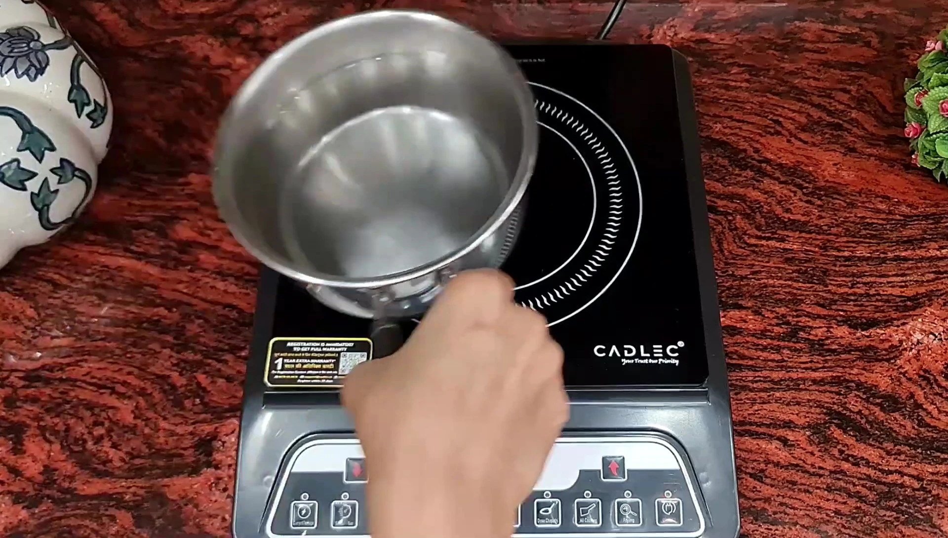 The cooktop in use, demonstrating its fast boiling time.