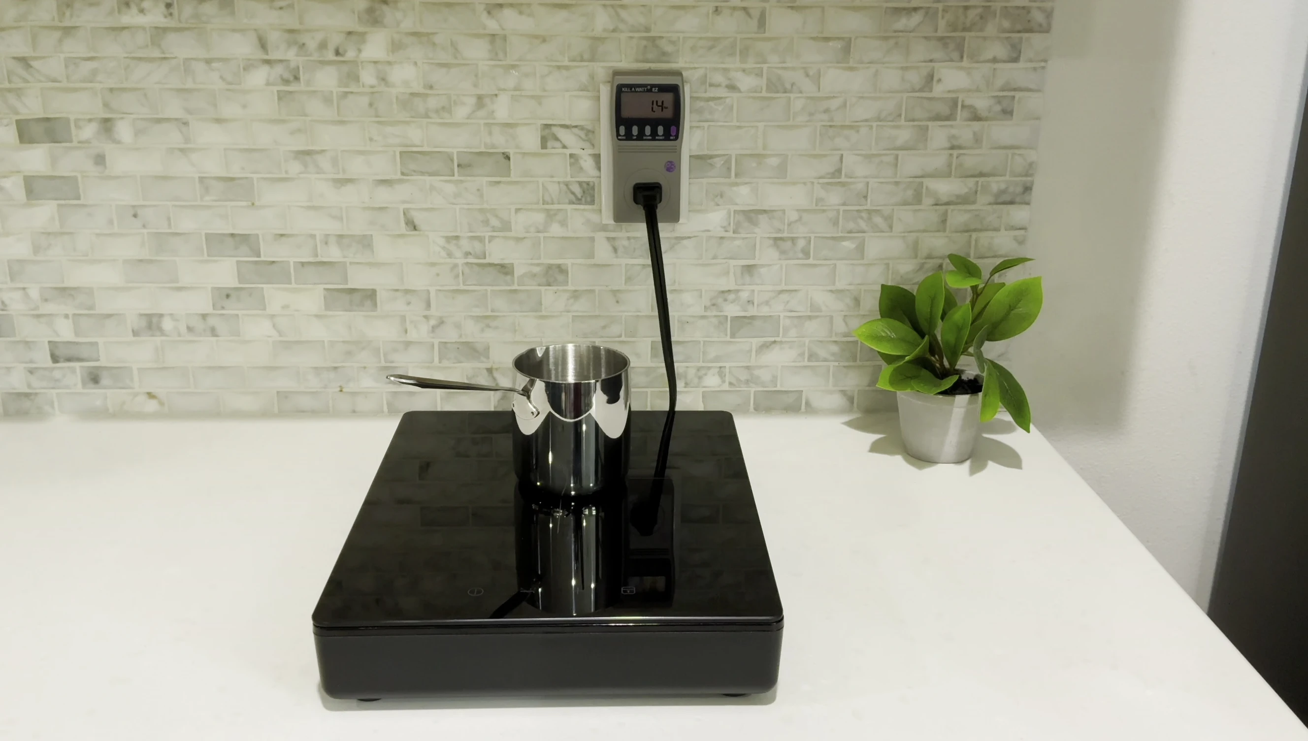 A small coffee pot being used on the cooktop.