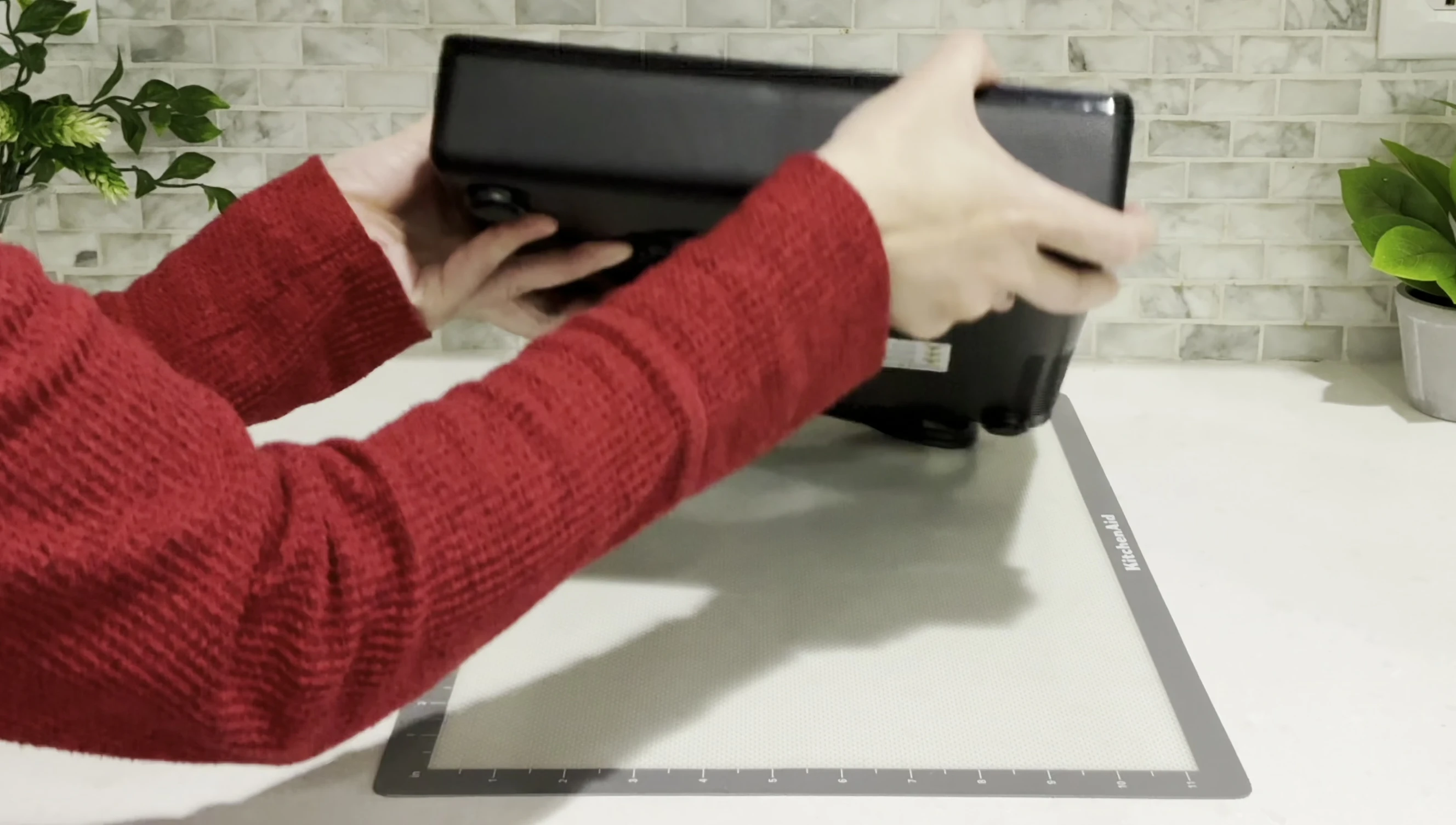 Close-up of the cooktop's top surface, highlighting the ceramic glass and beveled edges.