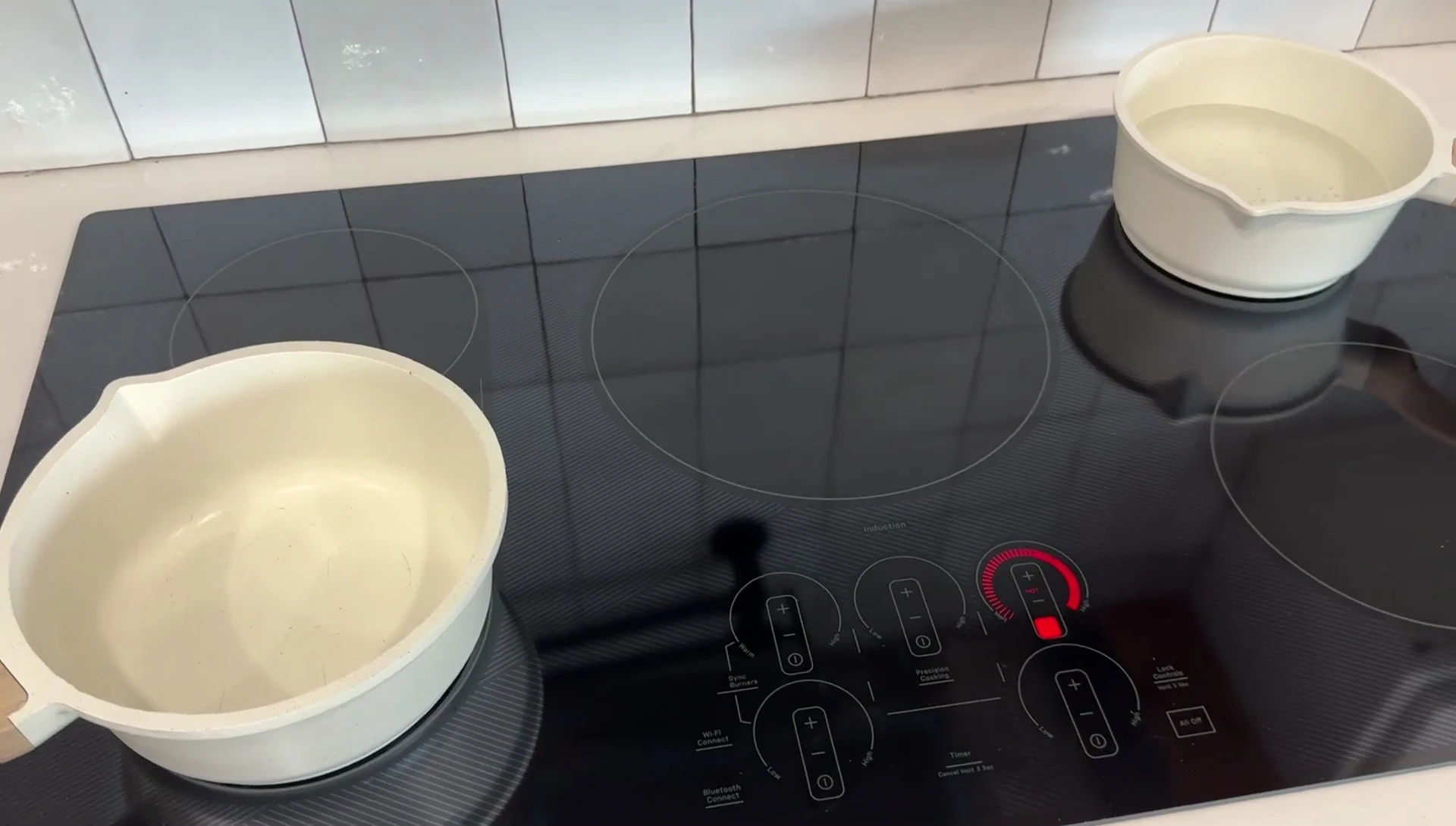 The induction cooktop with the pot on and slight buzz sound.