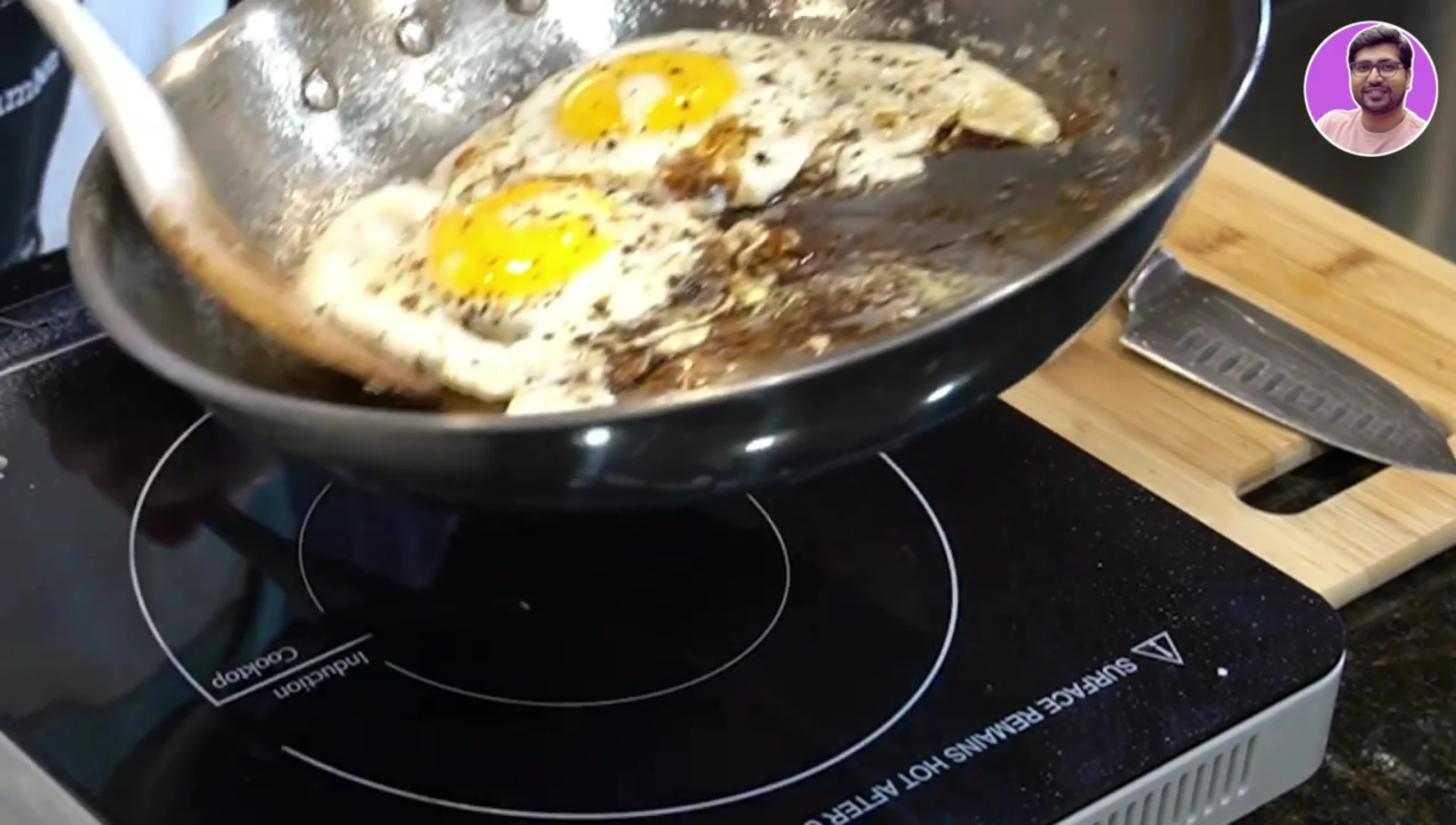Cautionary image regarding spills on an induction cooktop