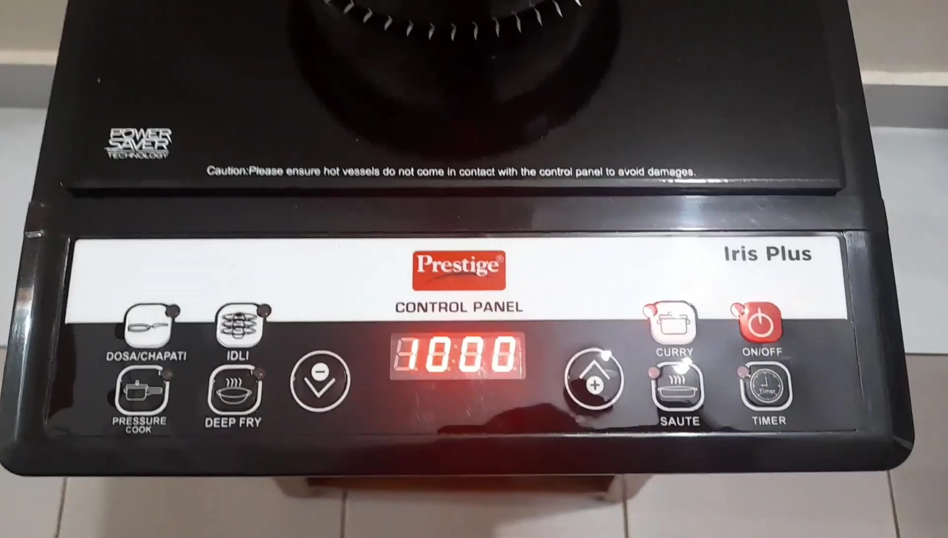 The water rapidly boiling on the cooktop.