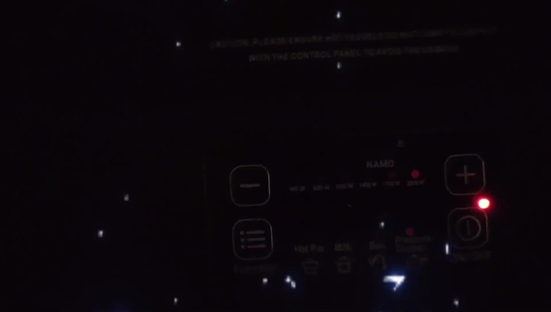 Close-up of the control panel, highlighting the push-button design.