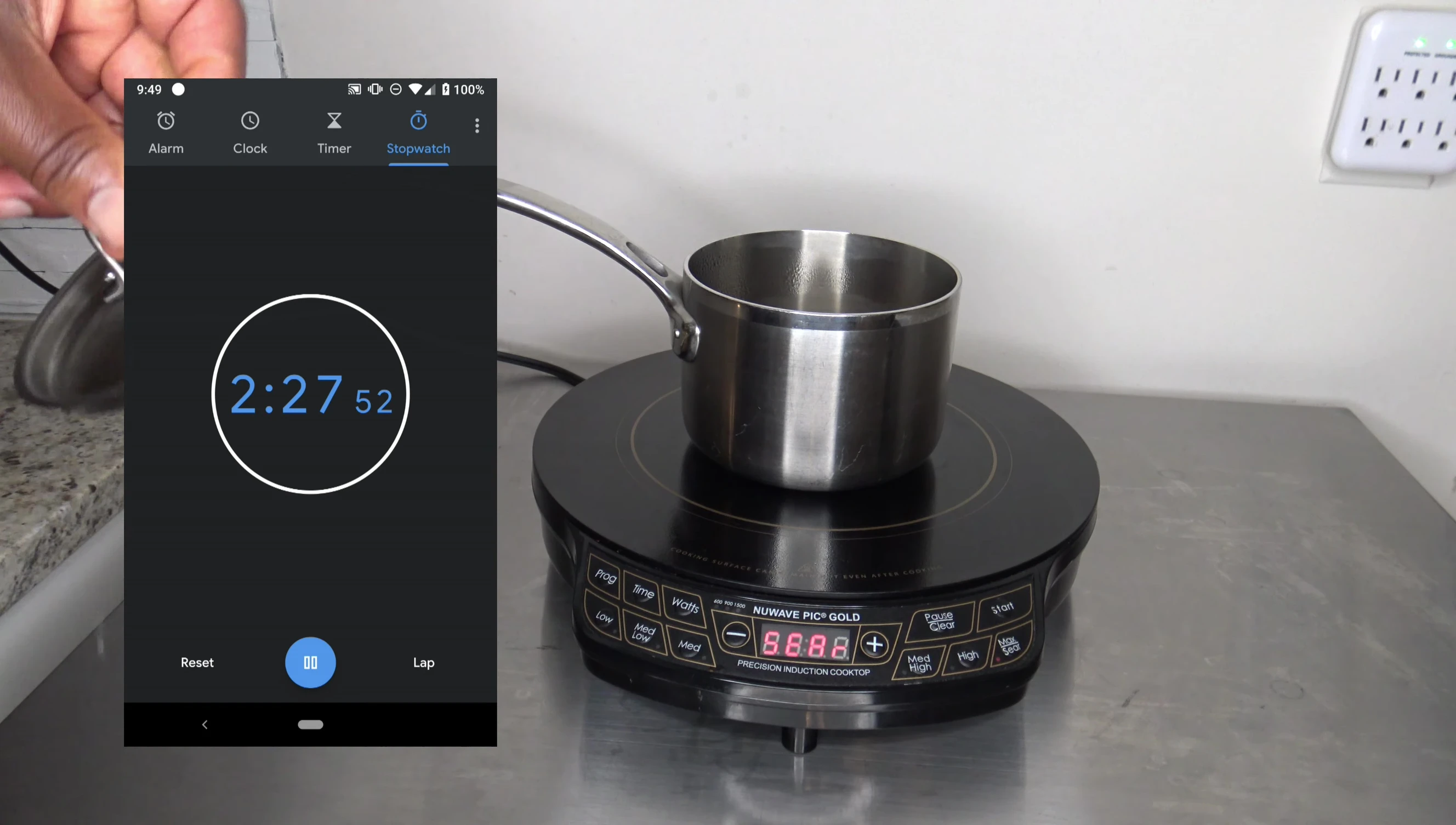 The water boiling vigorously on the cooktop