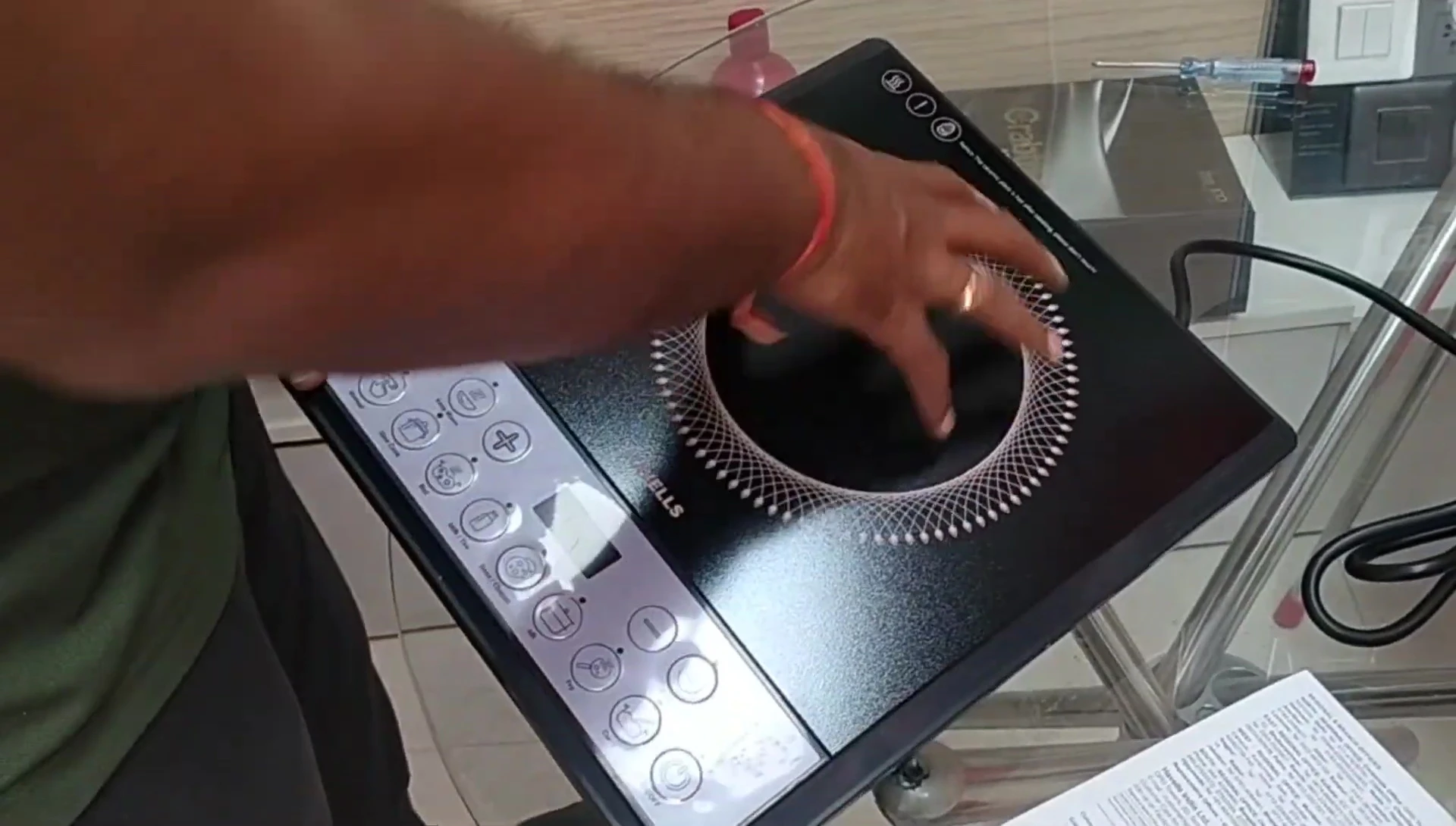 Close up of the control panel and cooking surface.