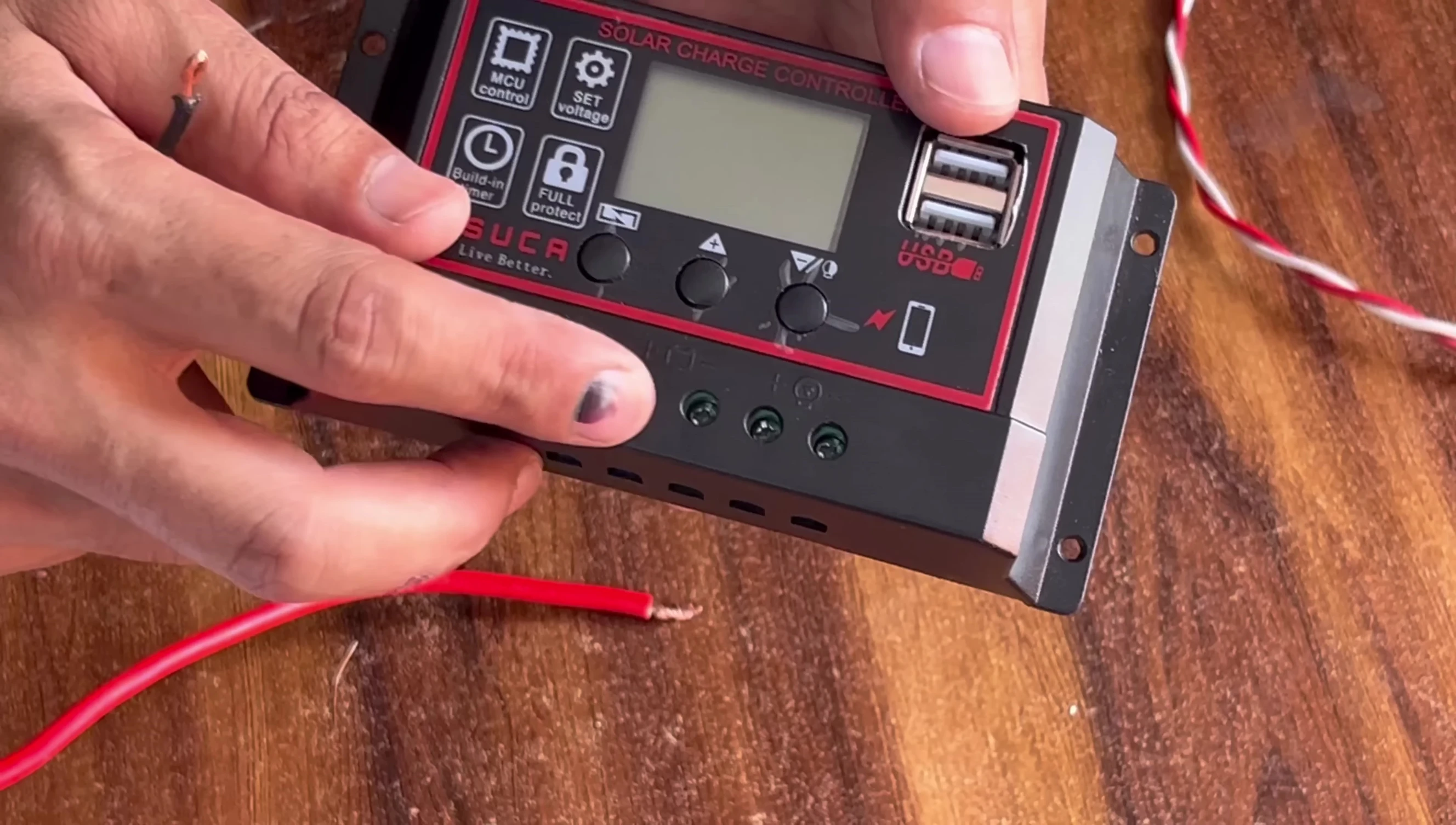 Close-up of battery connection points on the charge controller