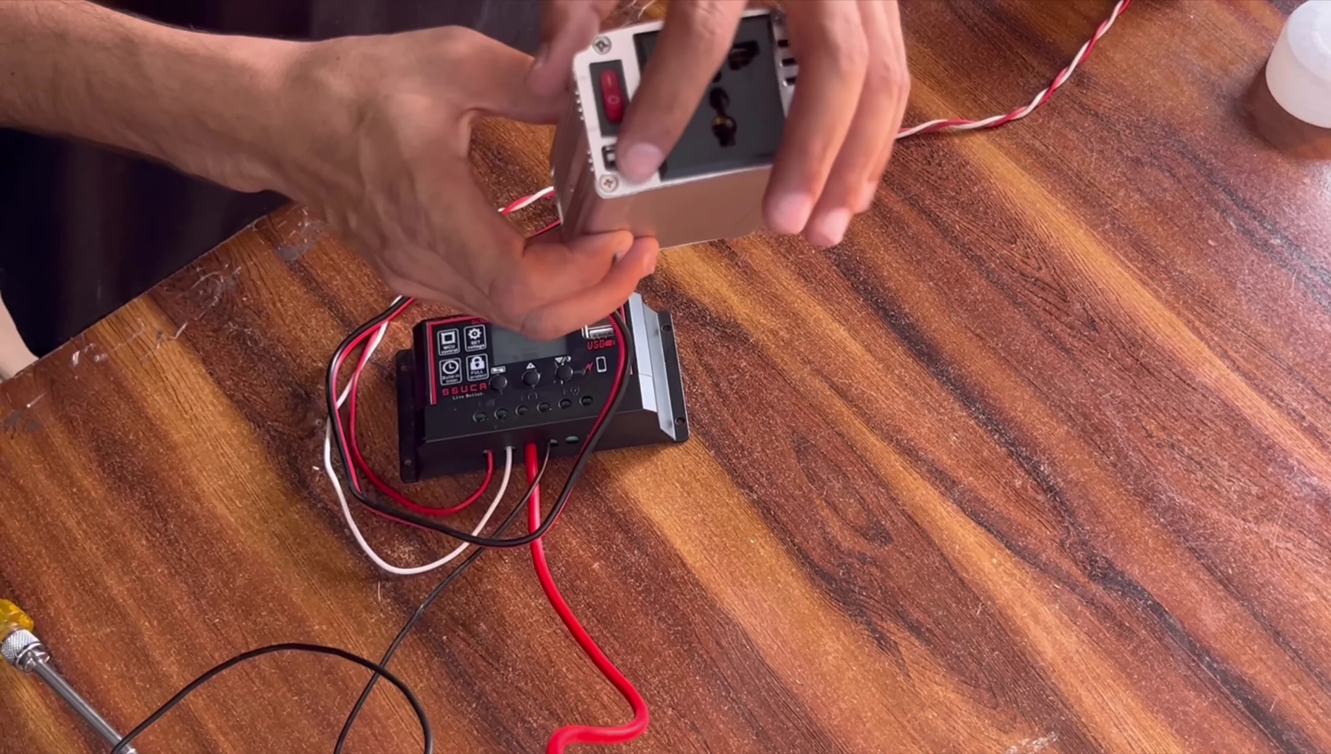 Close-up of the inverter's output socket and USB port