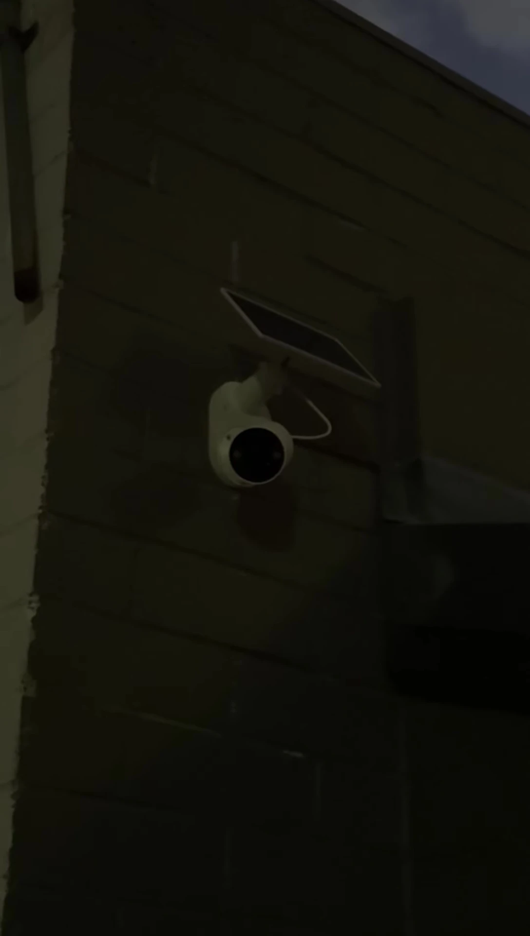The Tapo C410 camera with its spotlights illuminated.