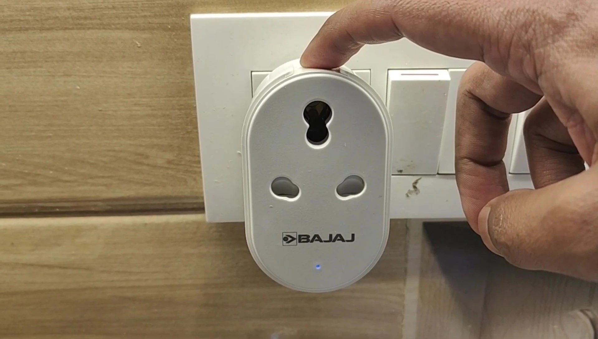 Instructions for initiating pairing mode on the Bajaj AWE 16 Amp Smart Plug.