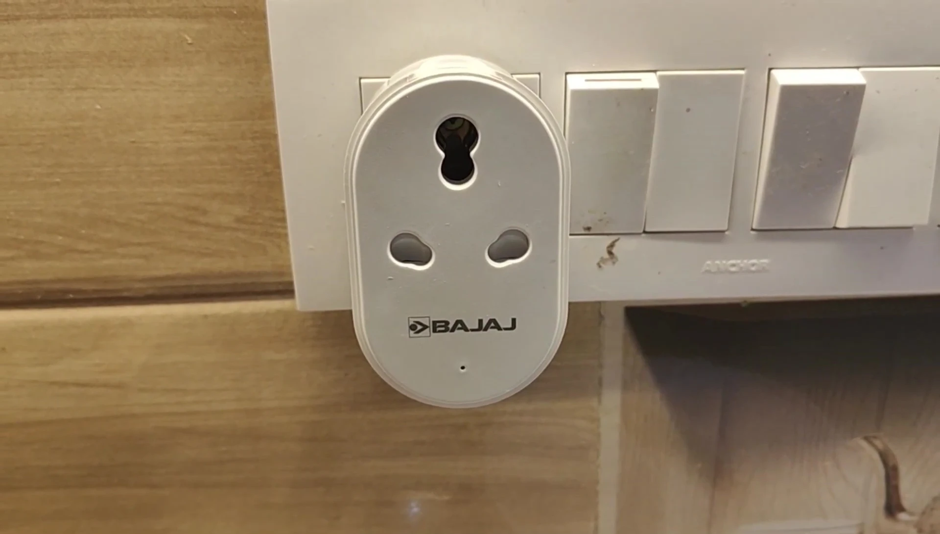 The blinking light indicating the smart plug is in pairing mode.