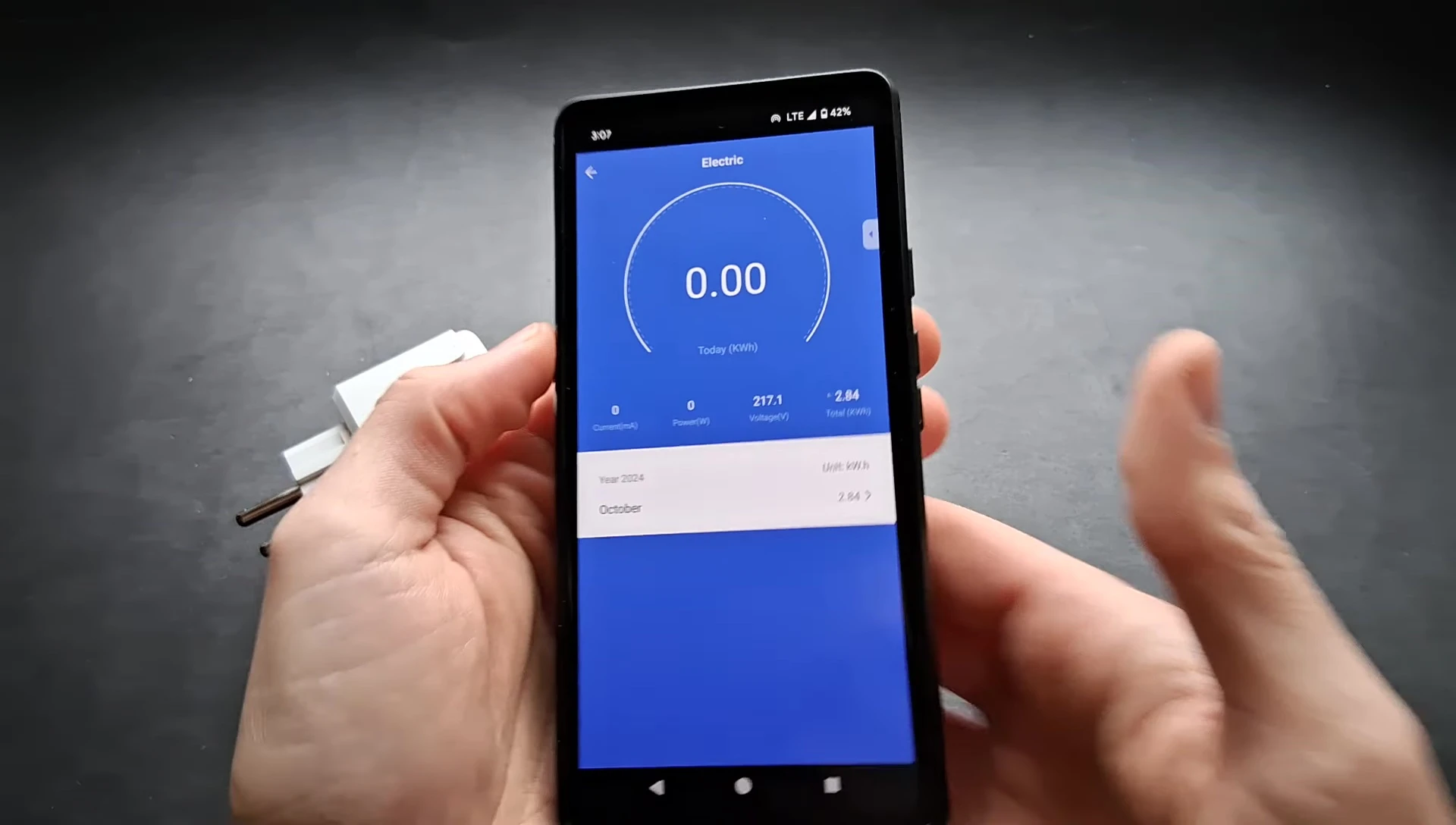 Screenshot of the app displaying power consumption of a phone charger.