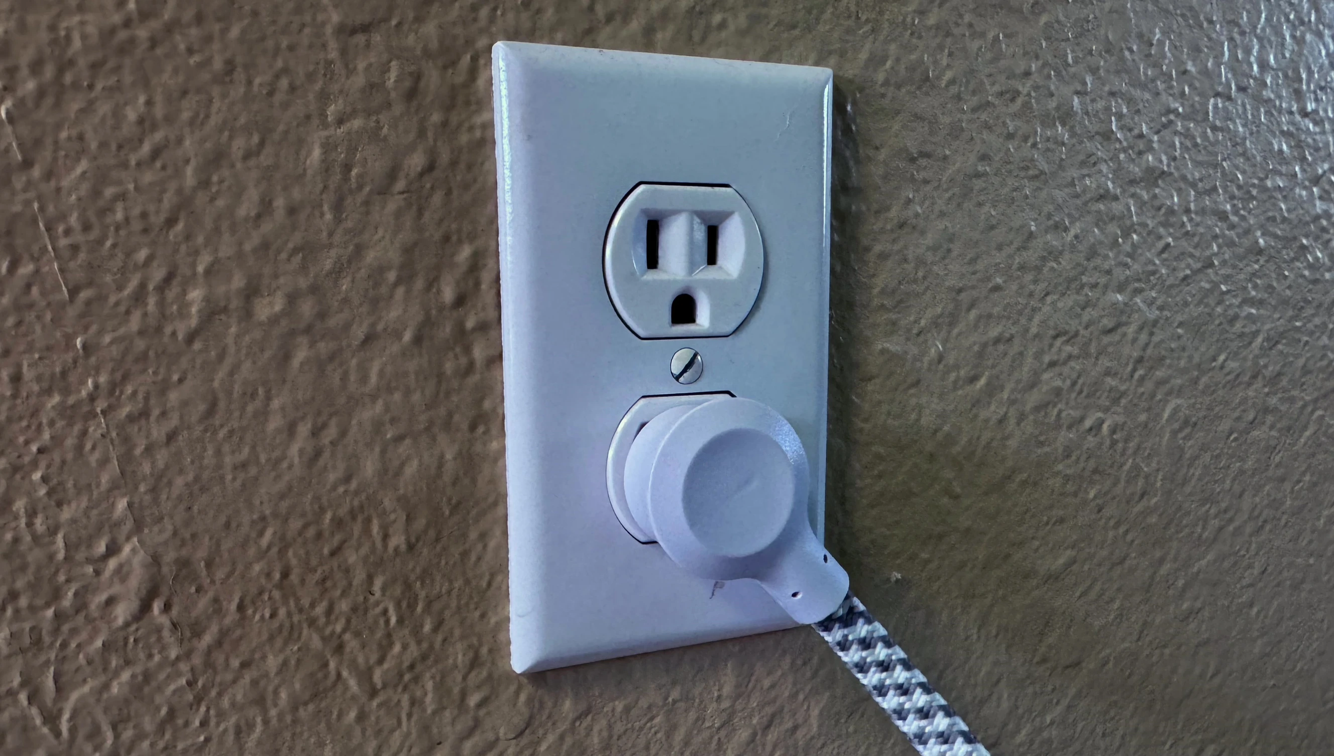 Demonstrating the flat wall mount design for easy, unobtrusive placement.