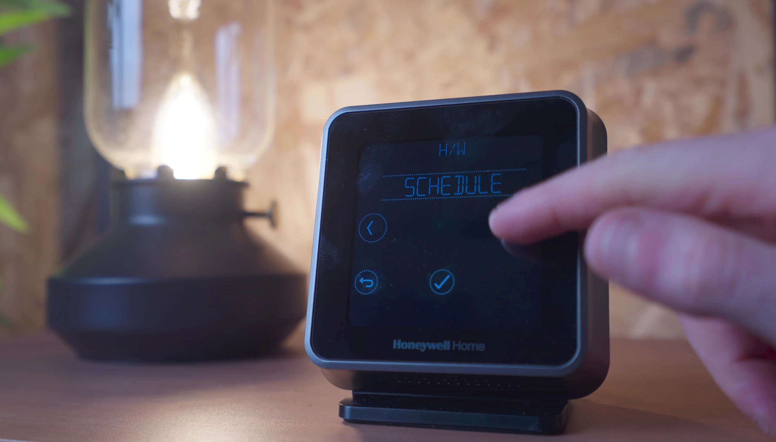 The hot water boost function on the thermostat.