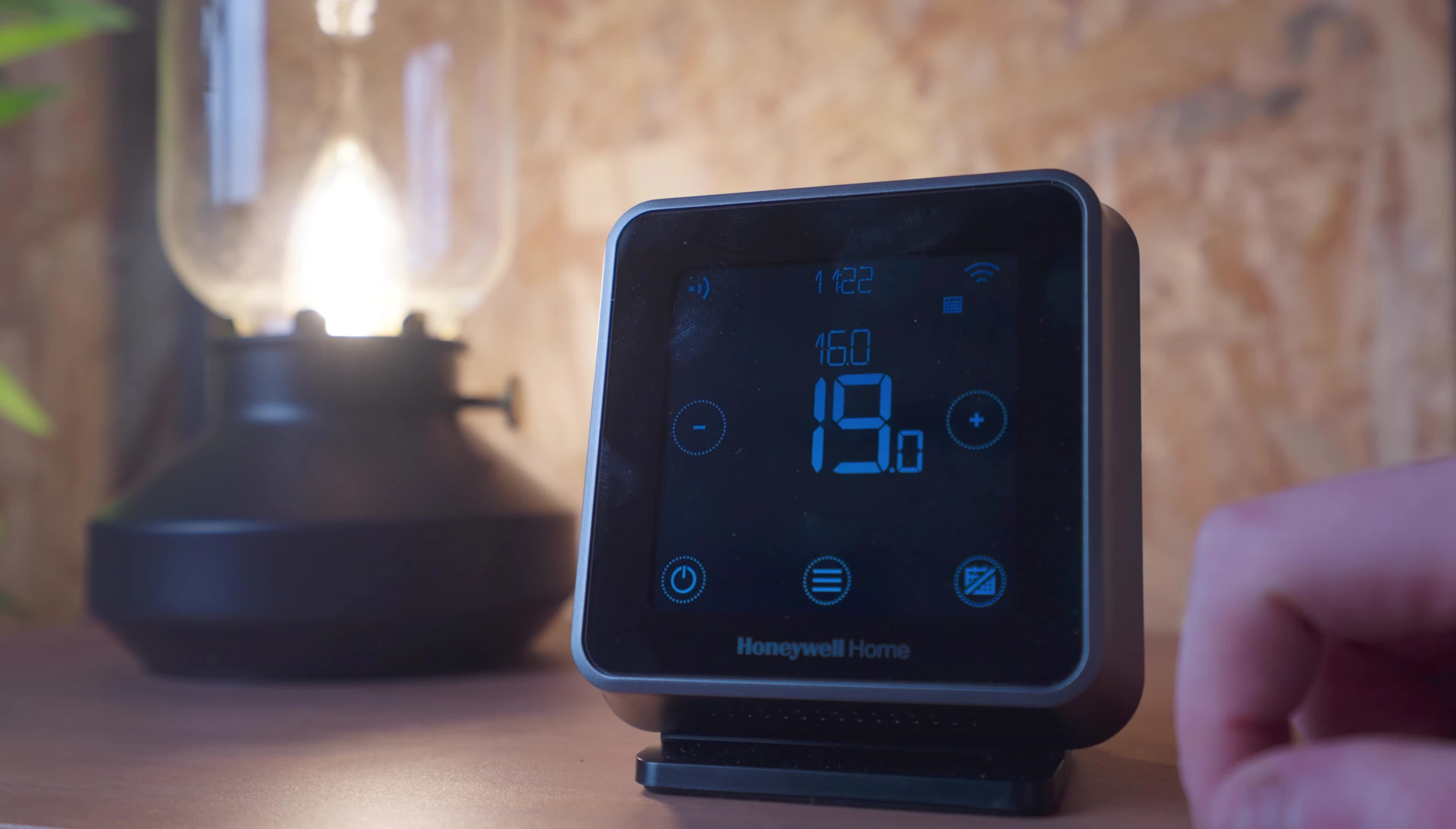 The calendar icon on the thermostat for switching modes.