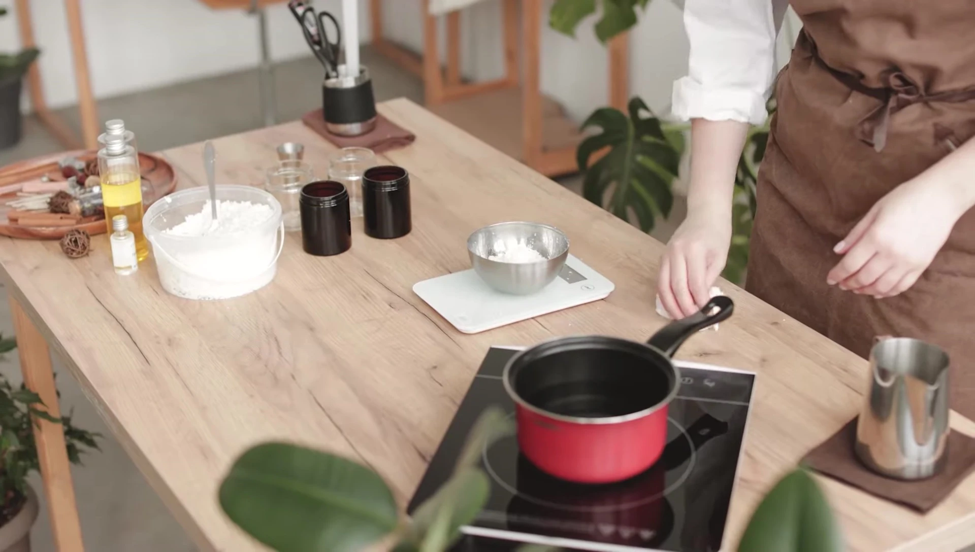 Instruction on cleaning spills from an induction cooktop surface