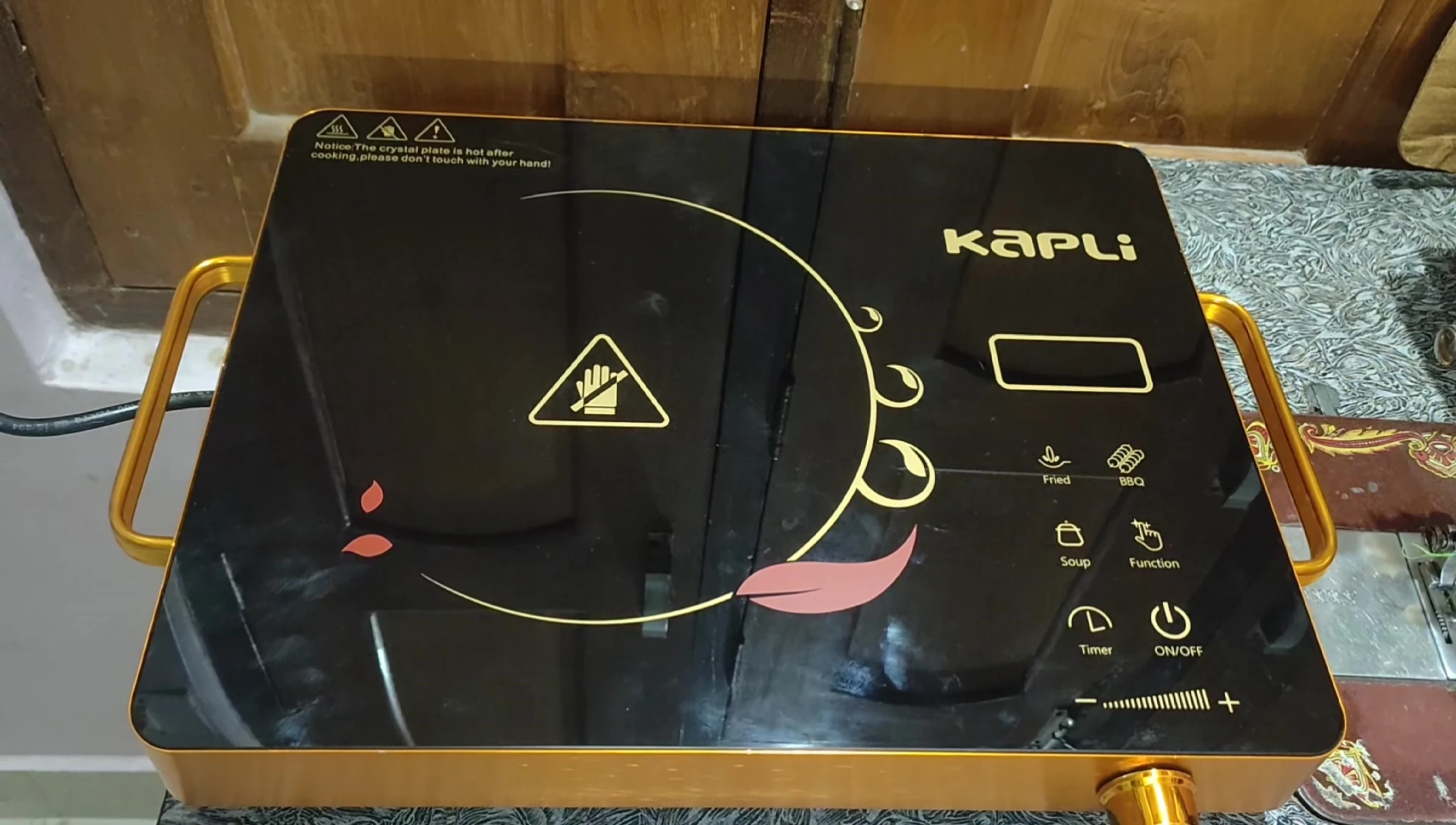 Turning on the cooktop and demonstrating the functionality.