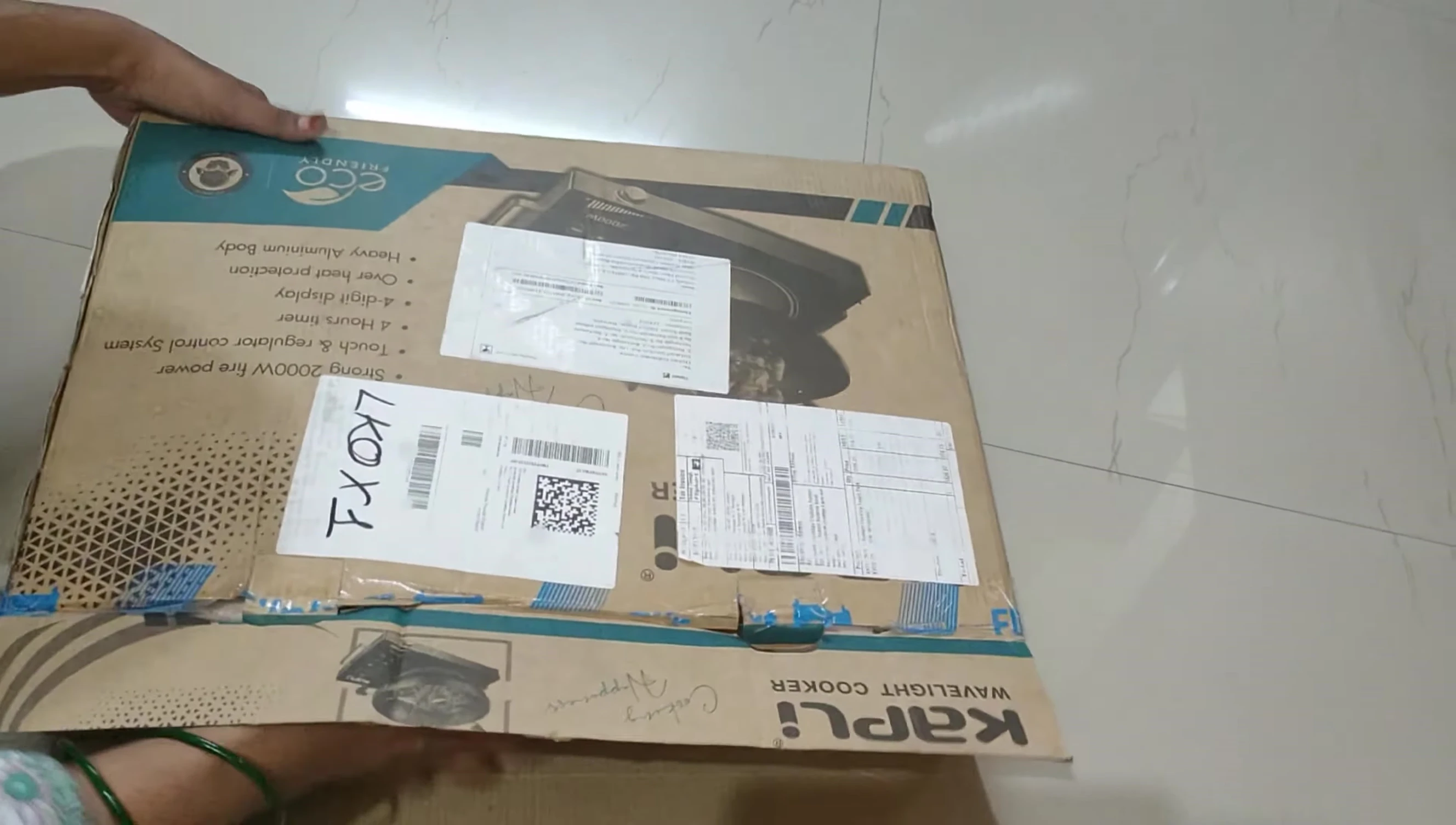 Taking the cooktop out of the box.