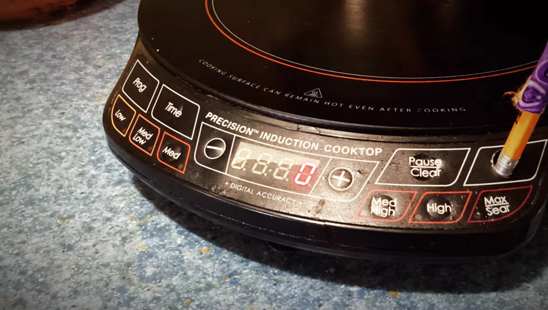 Demonstration of easy cleaning of the cooktop surface