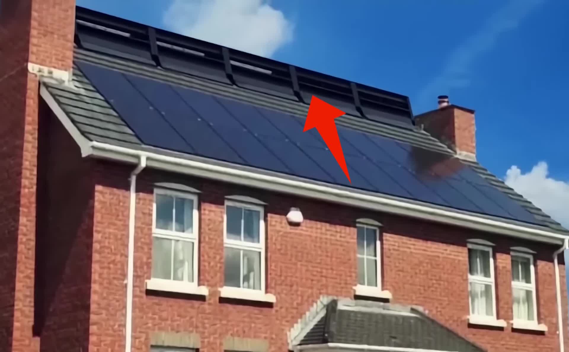 A view showing the RidgeBlade RB1 installed on a residential roof.