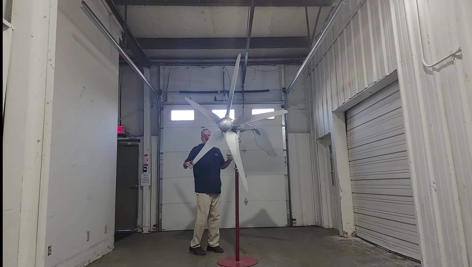 The presenter shows the sealed generator housing
