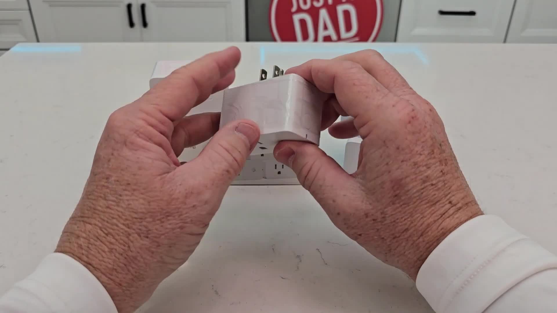 Close-up of the Govee smart plug still in its protective plastic wrapping.